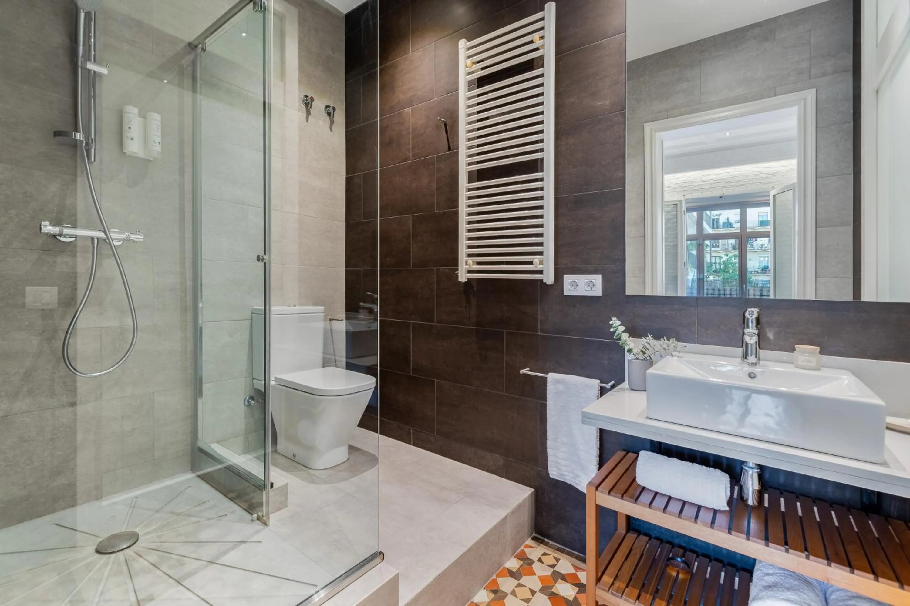 Shower in Fuster Apartments by Aspasios