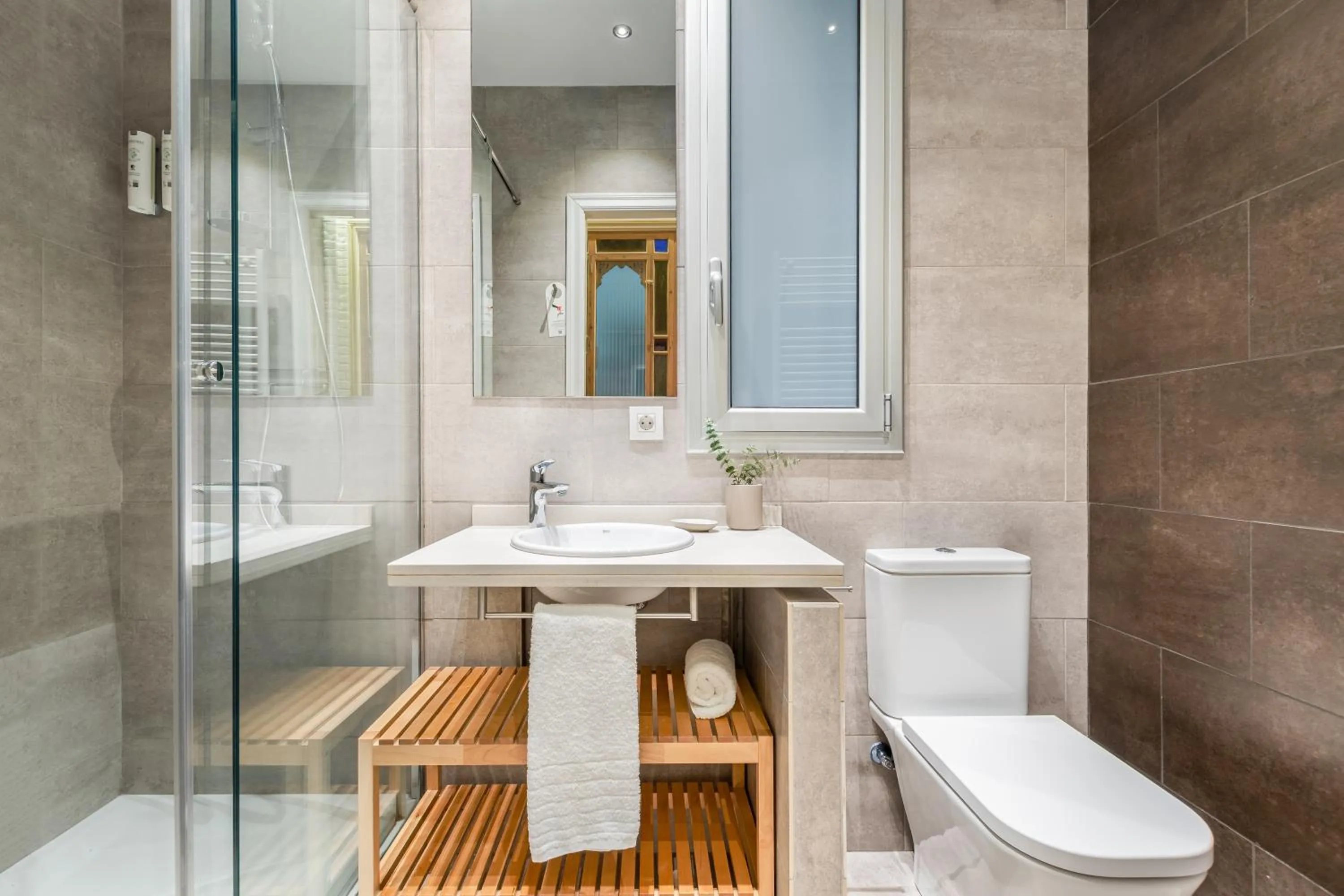 Shower in Fuster Apartments by Aspasios