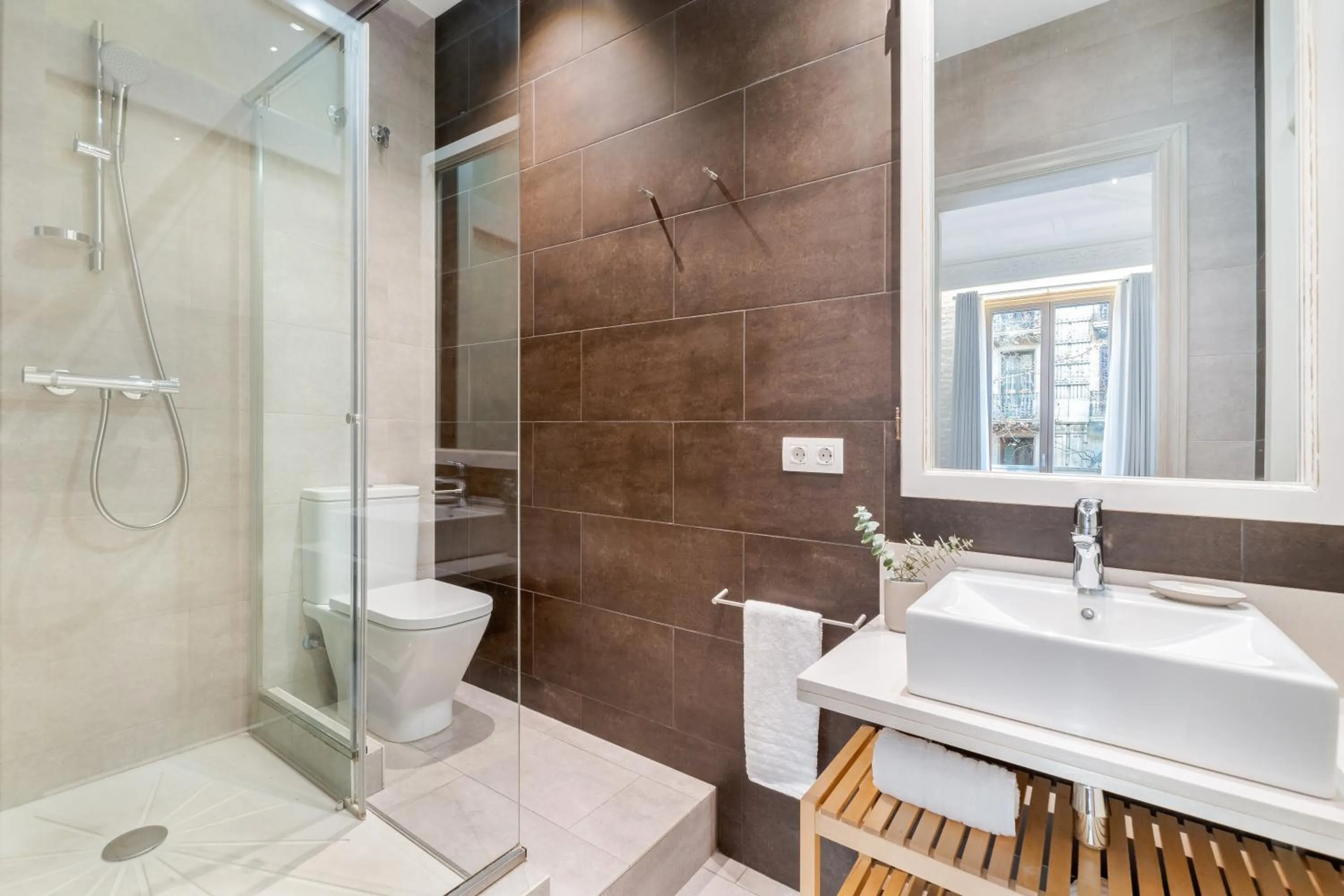 Shower in Fuster Apartments by Aspasios