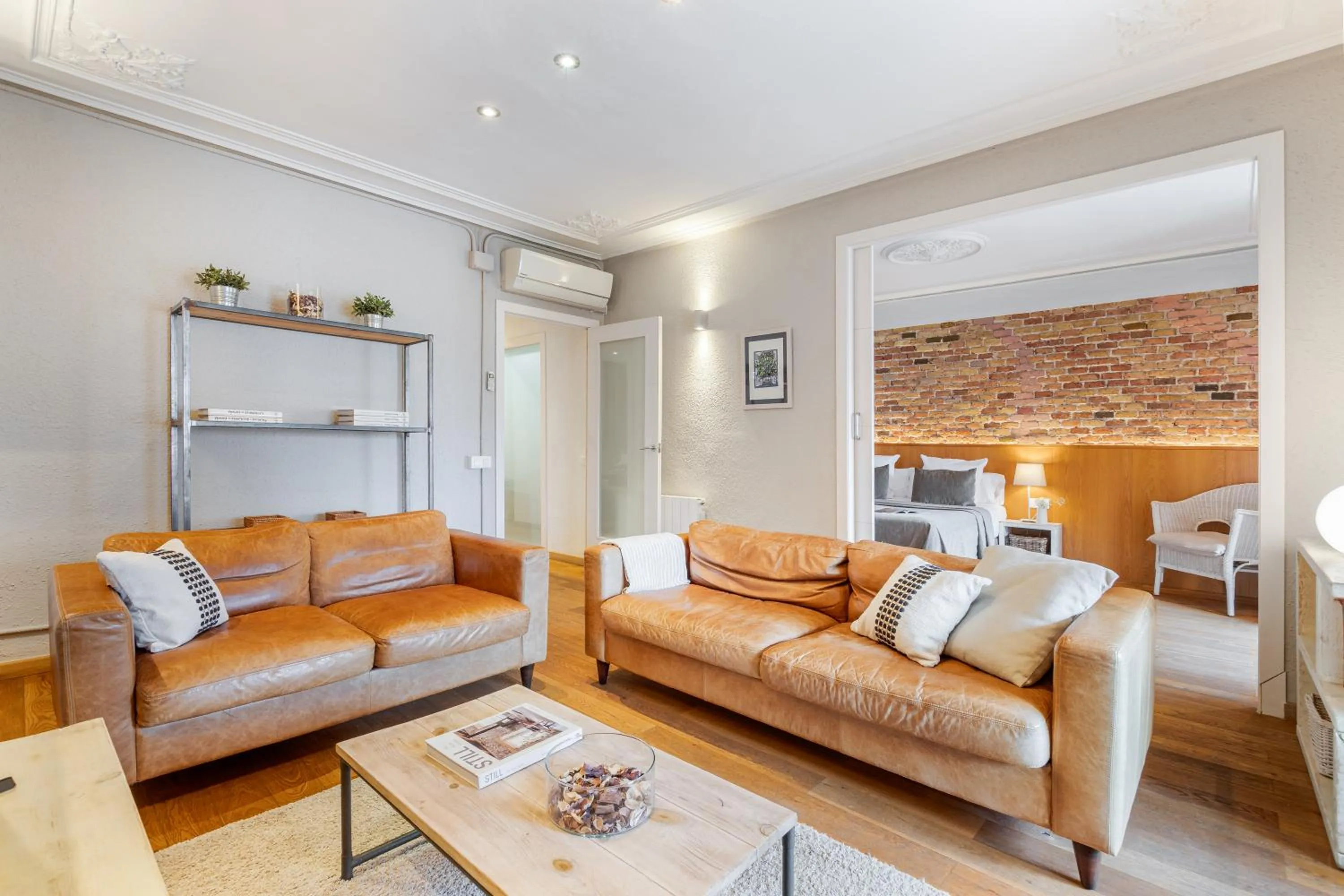 Living room in Fuster Apartments by Aspasios