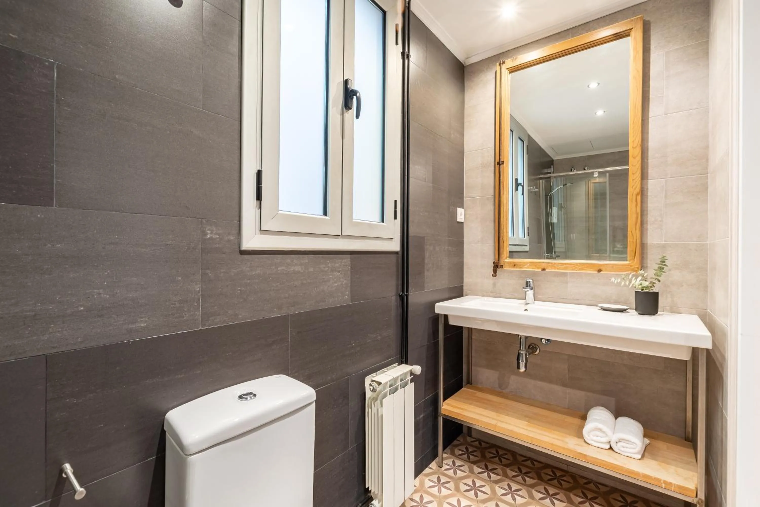 Shower in Fuster Apartments by Aspasios