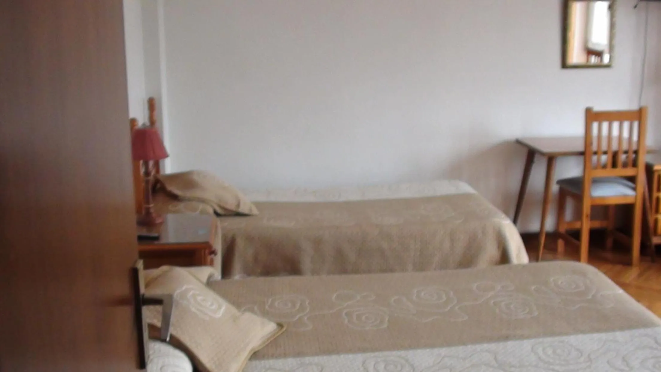 Photo of the whole room, Bed in Pension Santa Rita