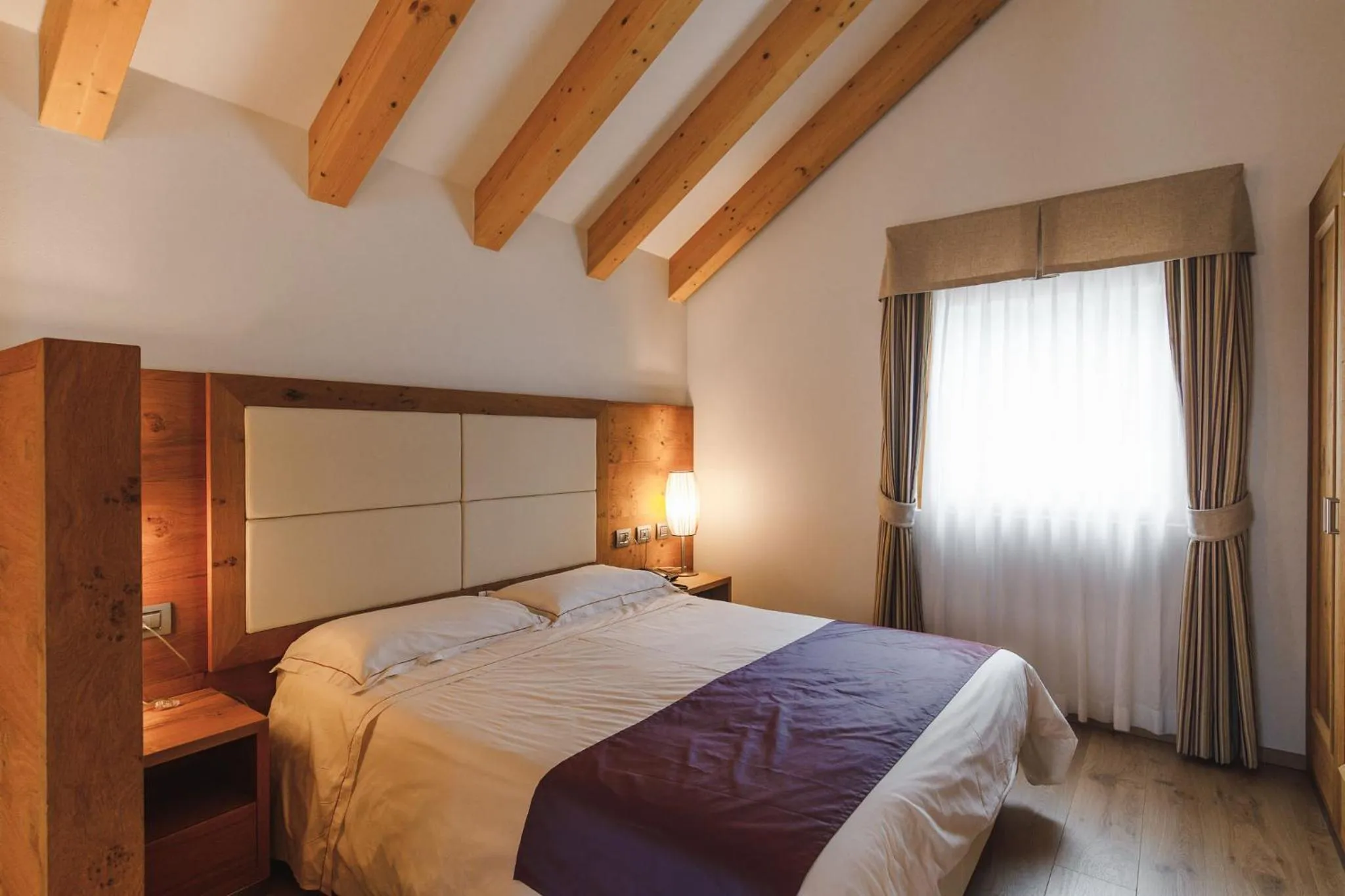 Bed in Sayonara Nature & Wellness Hotel