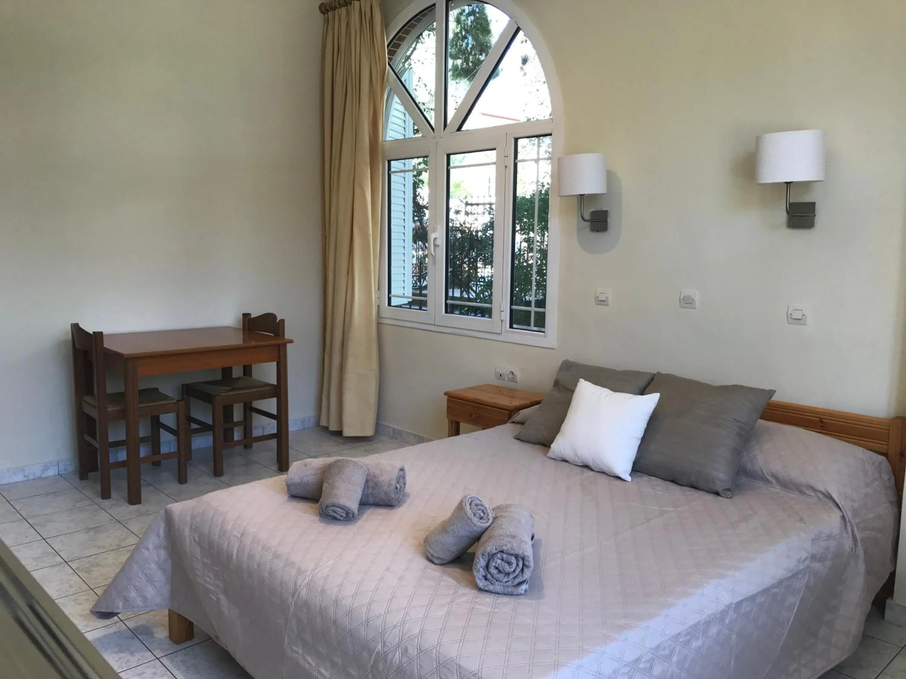 Bed in Calypso Beach Hotel