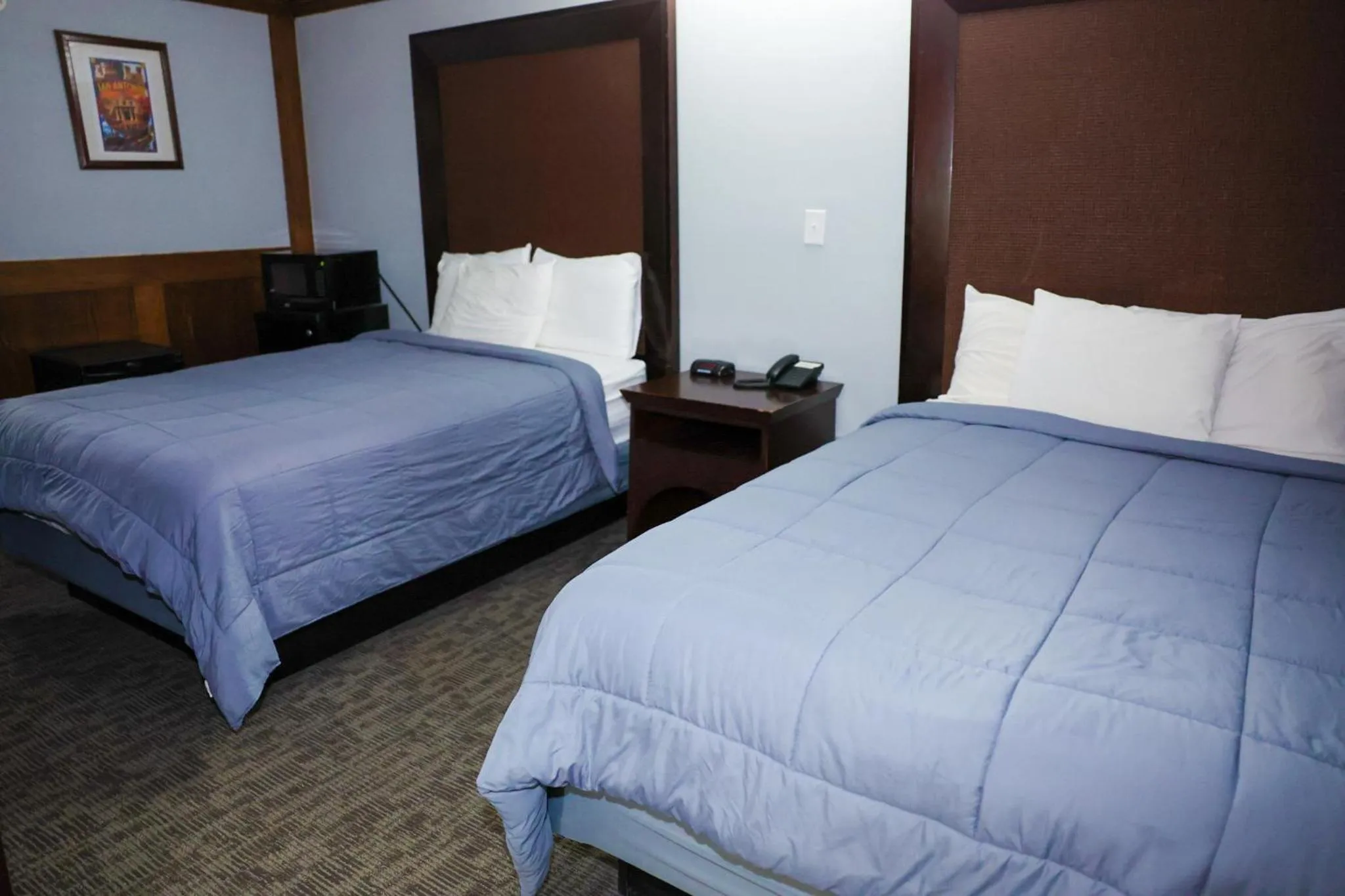 Bed in Rittiman Inn and Suites