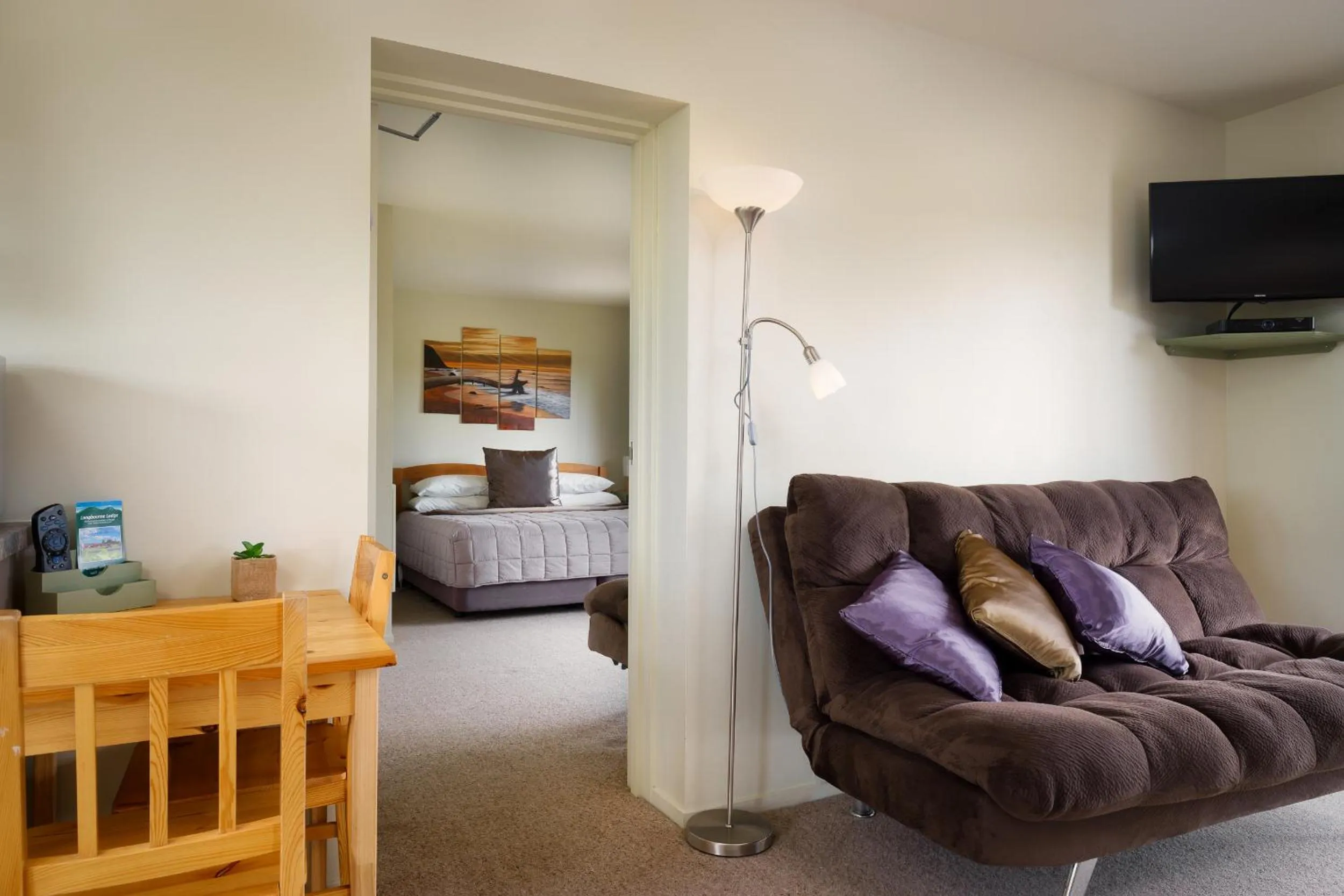 Living room, Bed in Longbourne Lodge Motel Mosgiel
