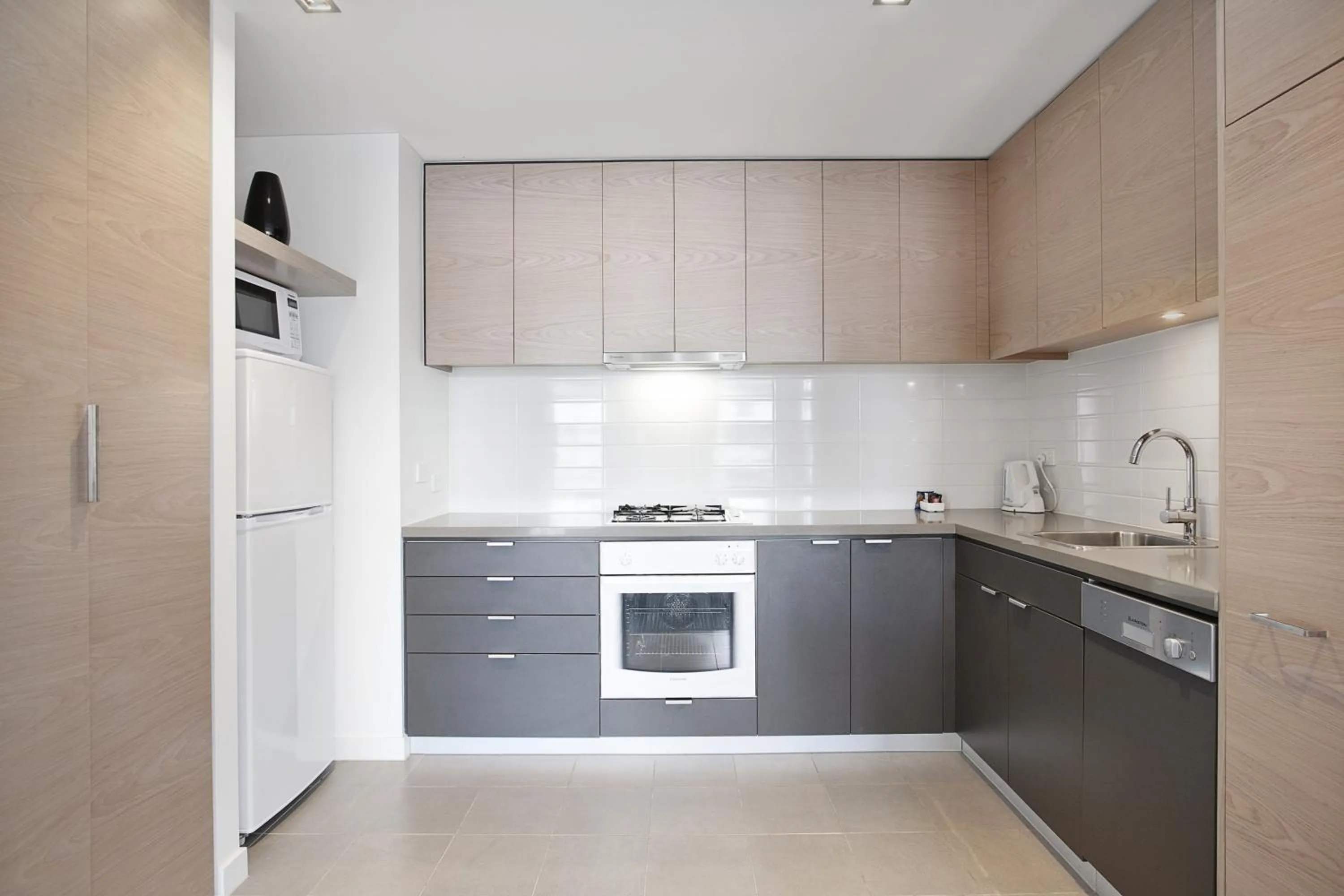 Kitchen or kitchenette in St Kilda Central Apartments