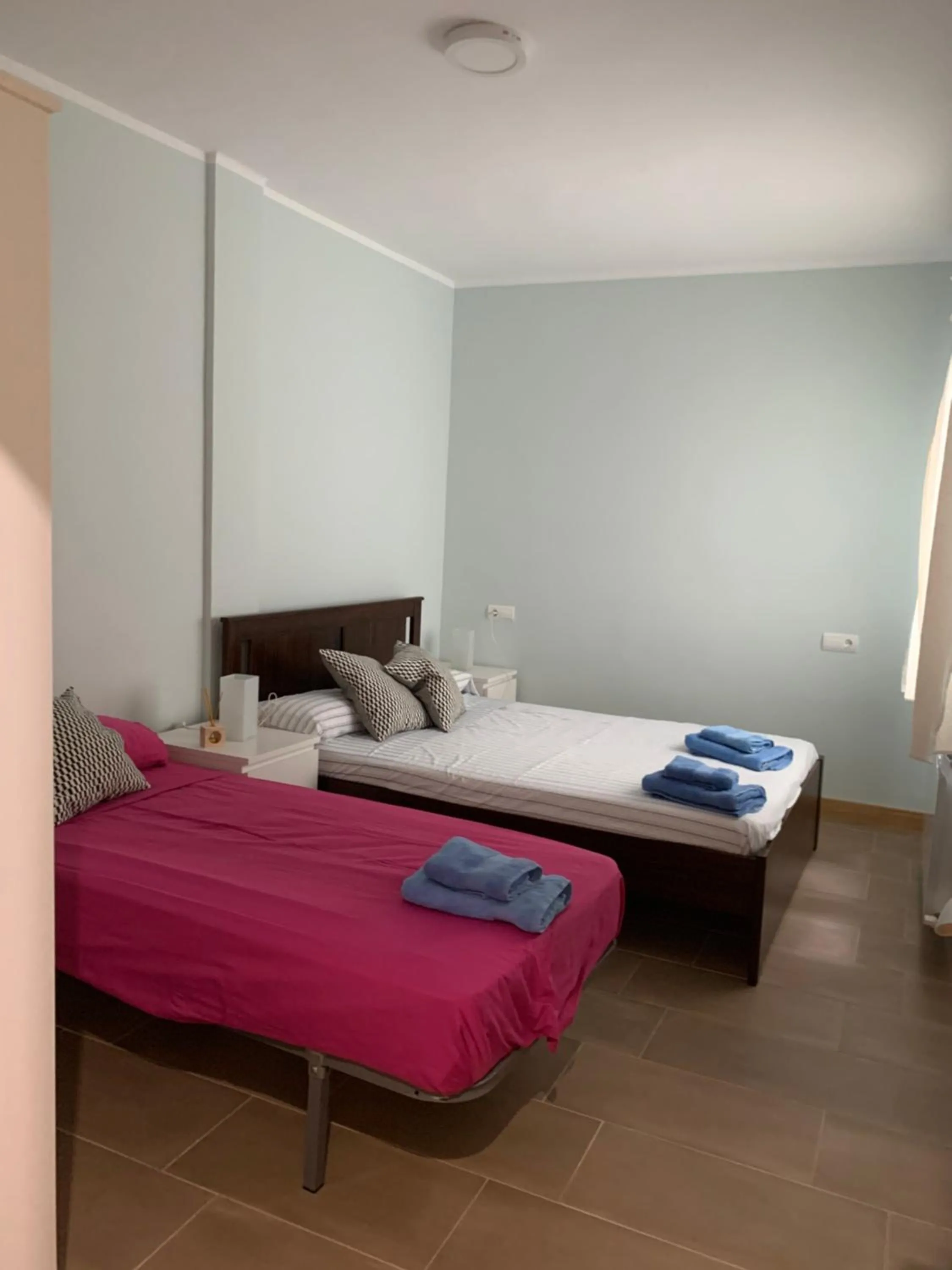 Bed in La Encina Azul Rooms-Grupo Rosa Azul