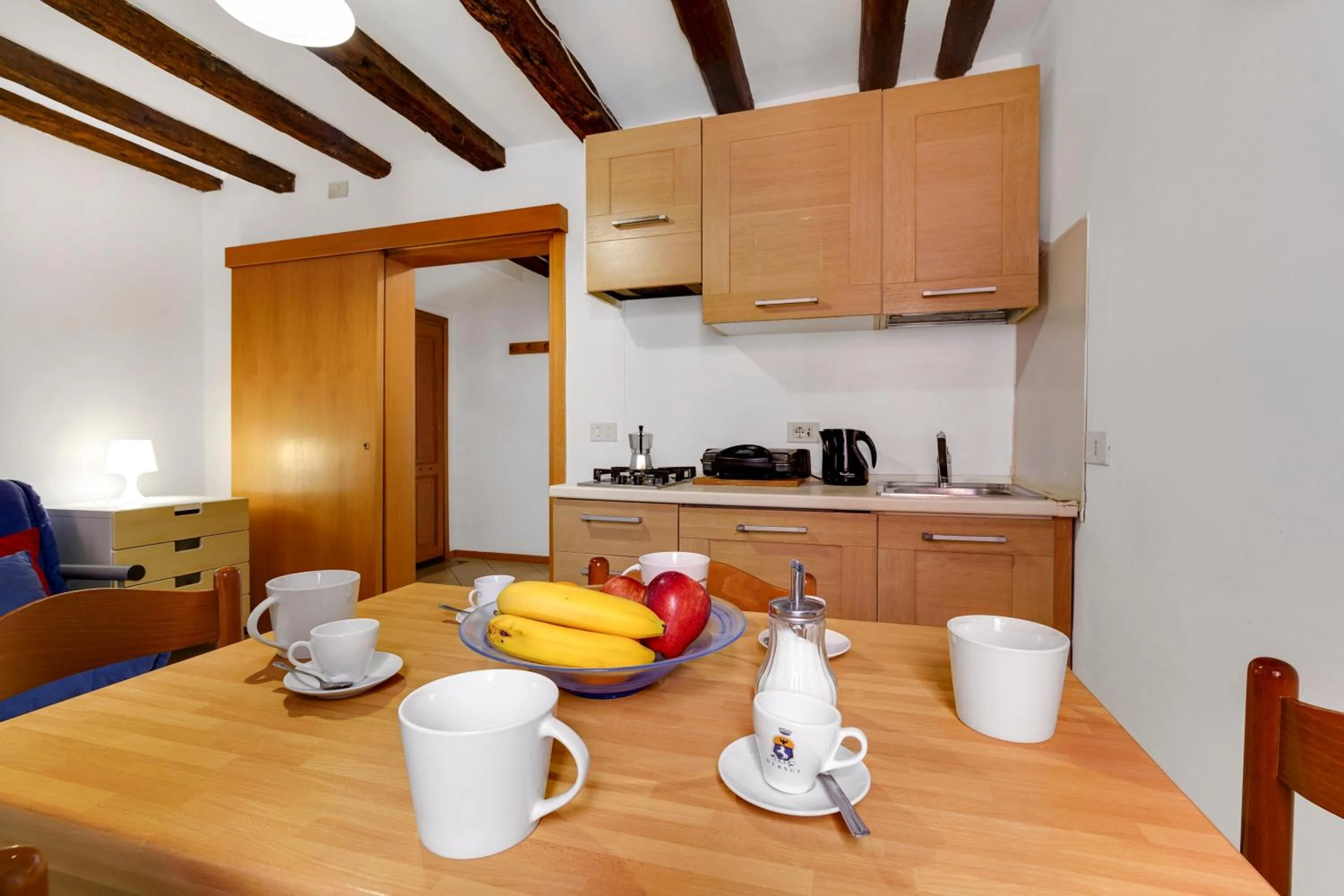 Communal lounge/ TV room in B&B Giardini