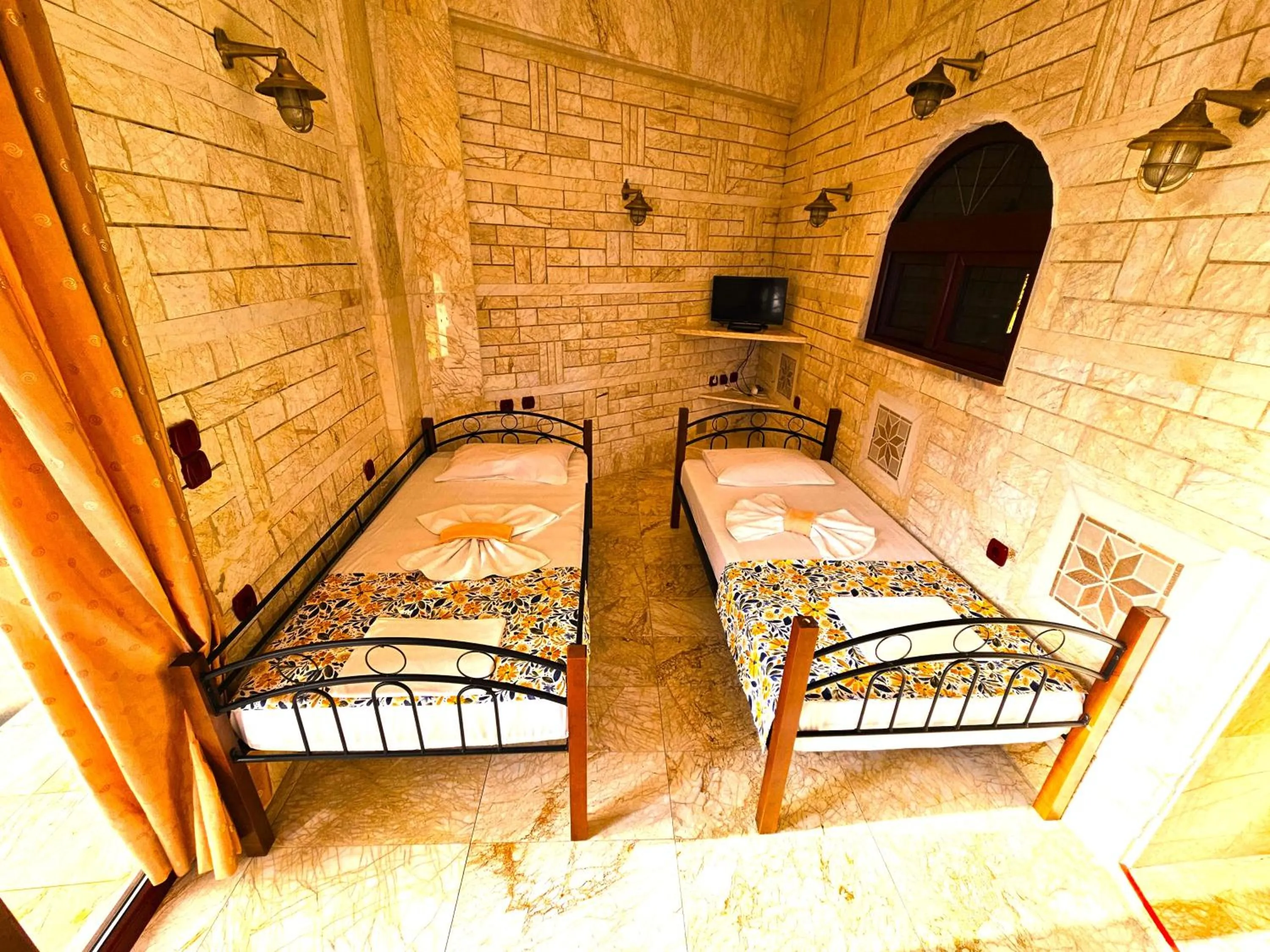 Bed in Paco's Resort Holiday Flats