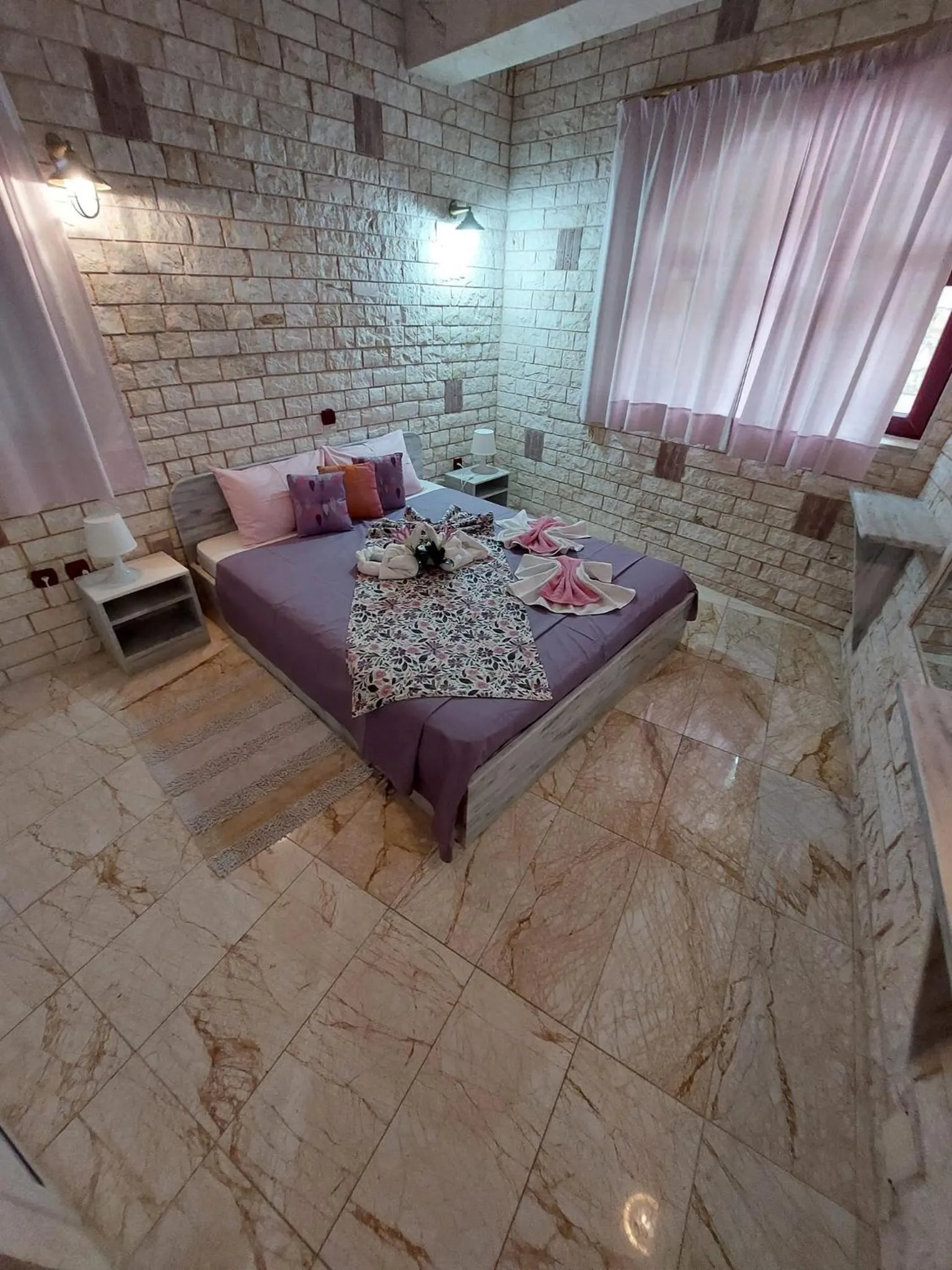 Bed in Paco's Resort Holiday Flats