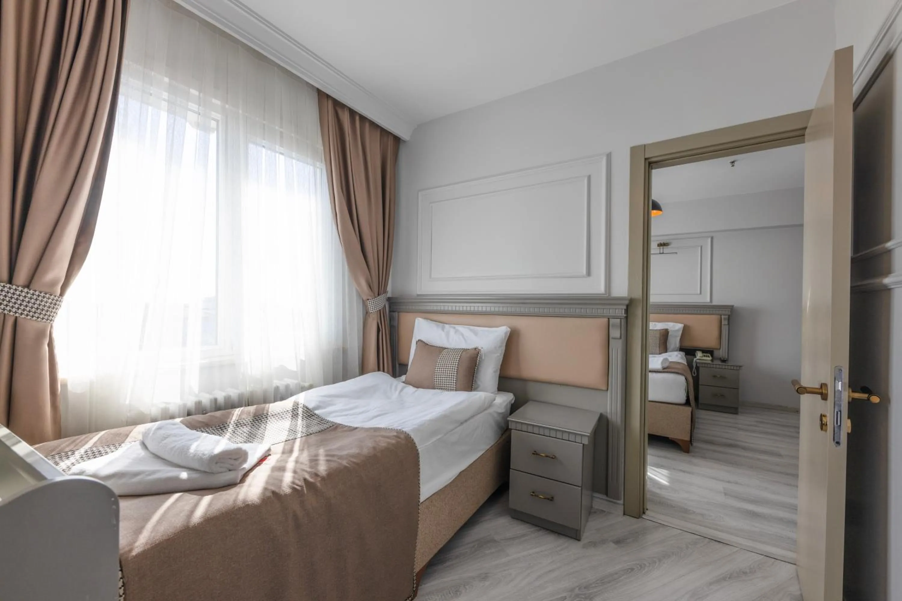 Bed in Kuran Hotel International