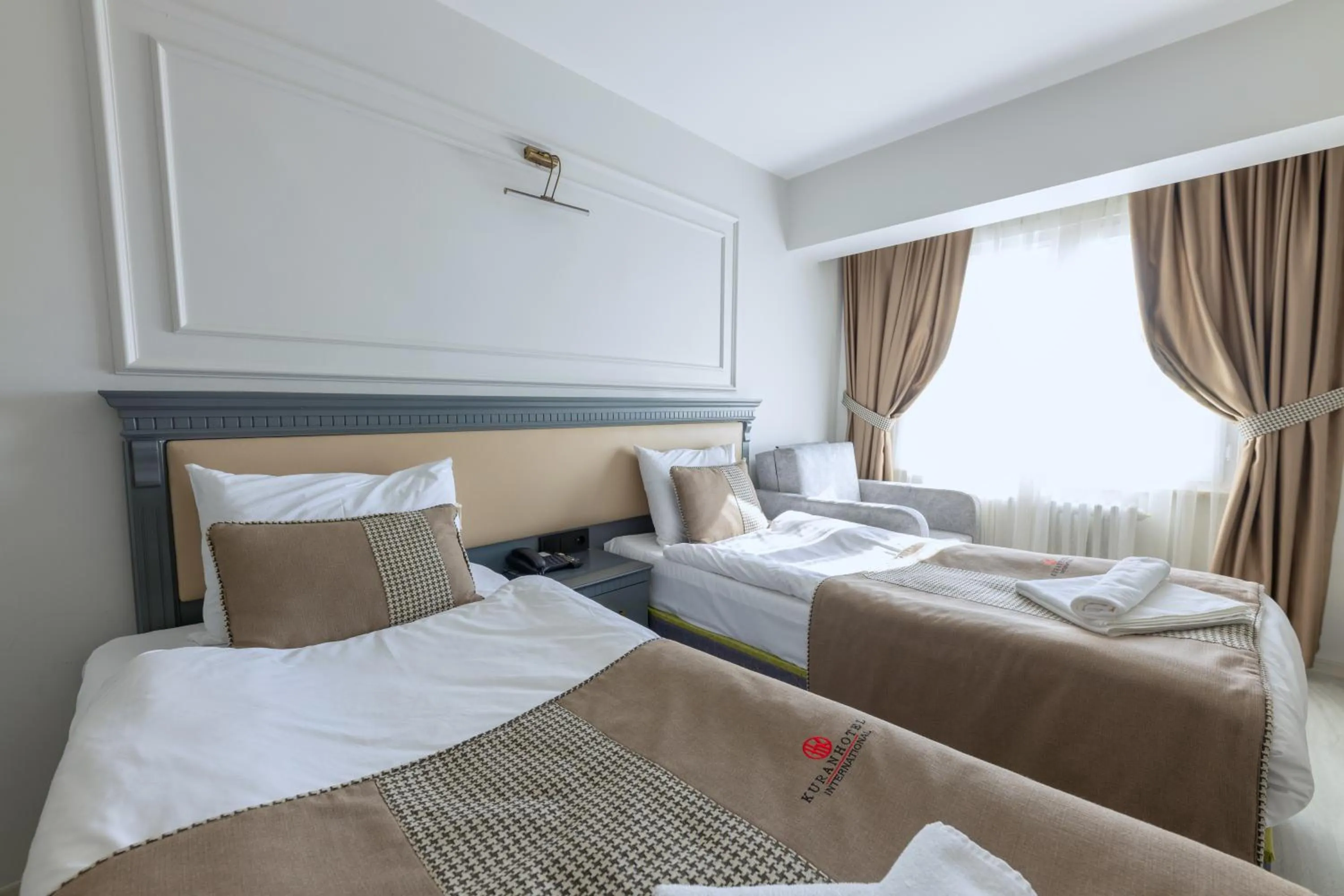 Bed in Kuran Hotel International