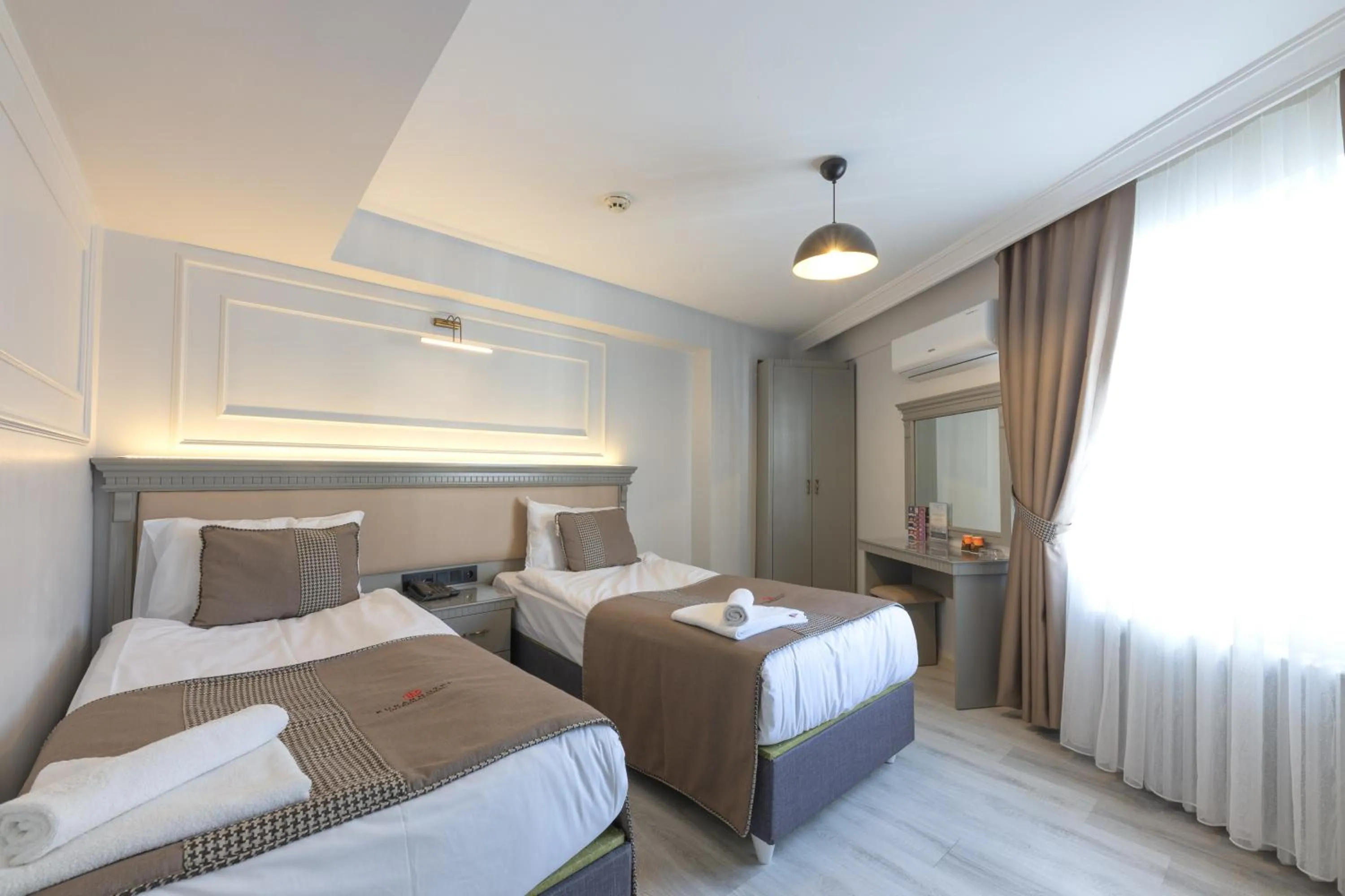 Bed in Kuran Hotel International