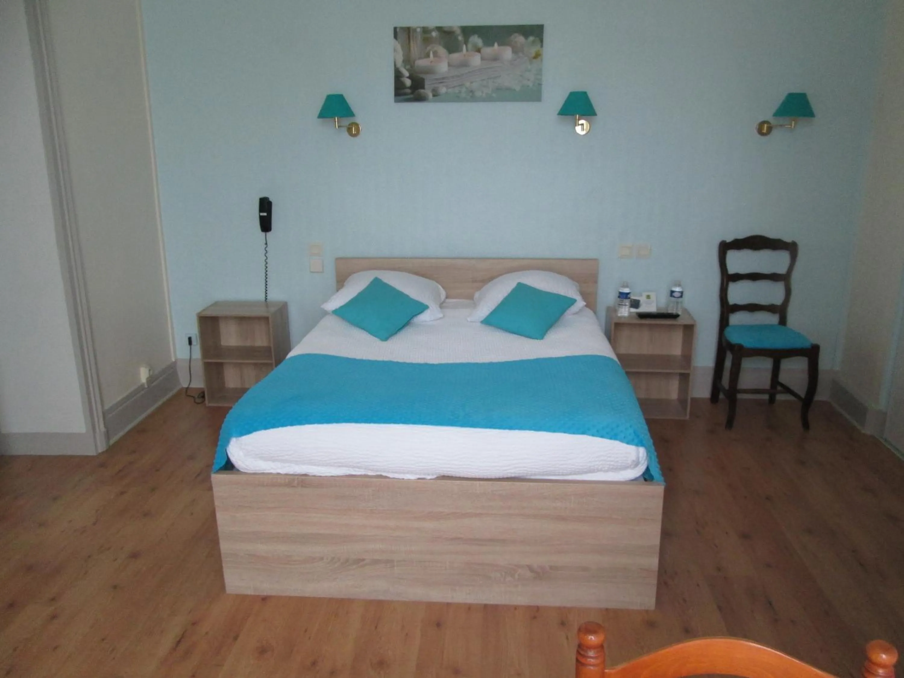 Bed in Logis Hôtel Beauséjour