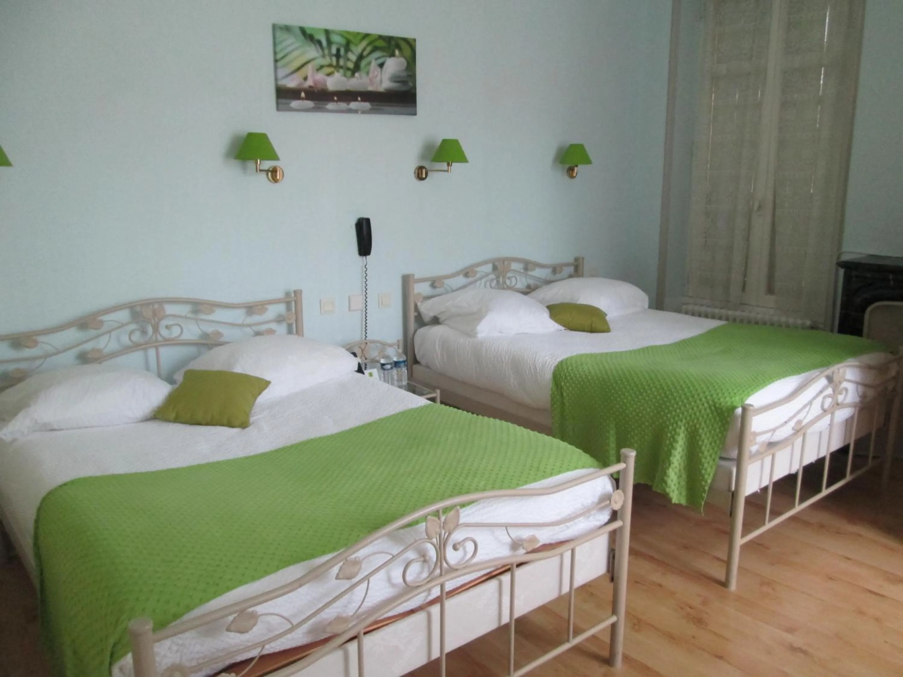 Bed in Logis Hôtel Beauséjour