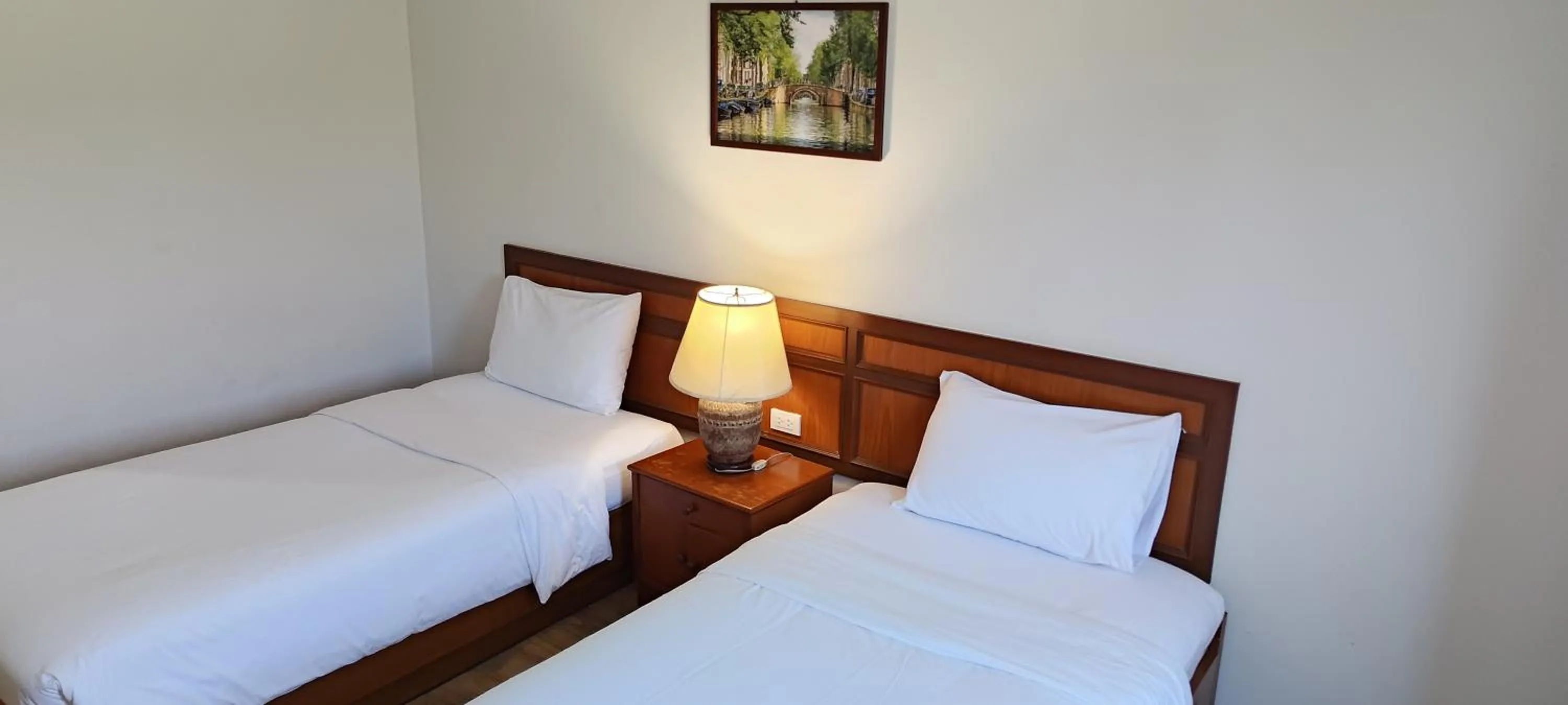 Bed in Puangpen Villa Hotel