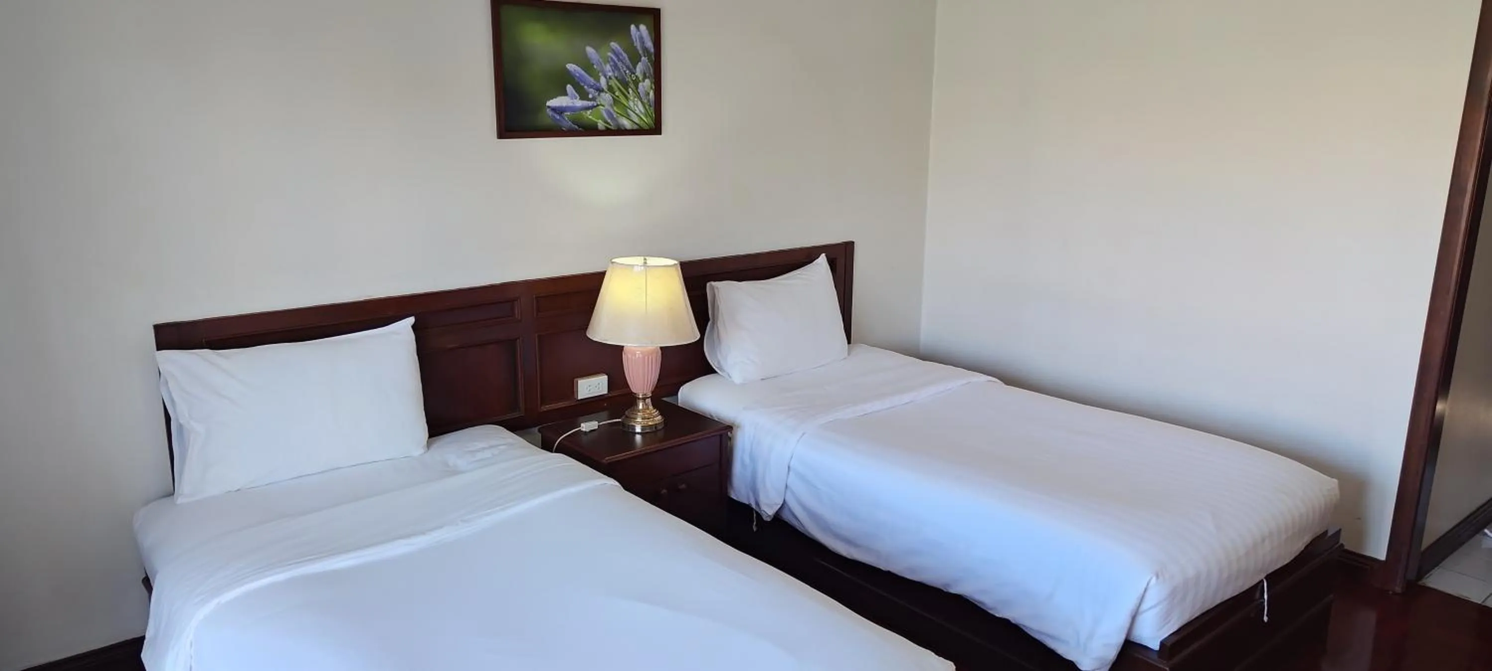 Bed in Puangpen Villa Hotel