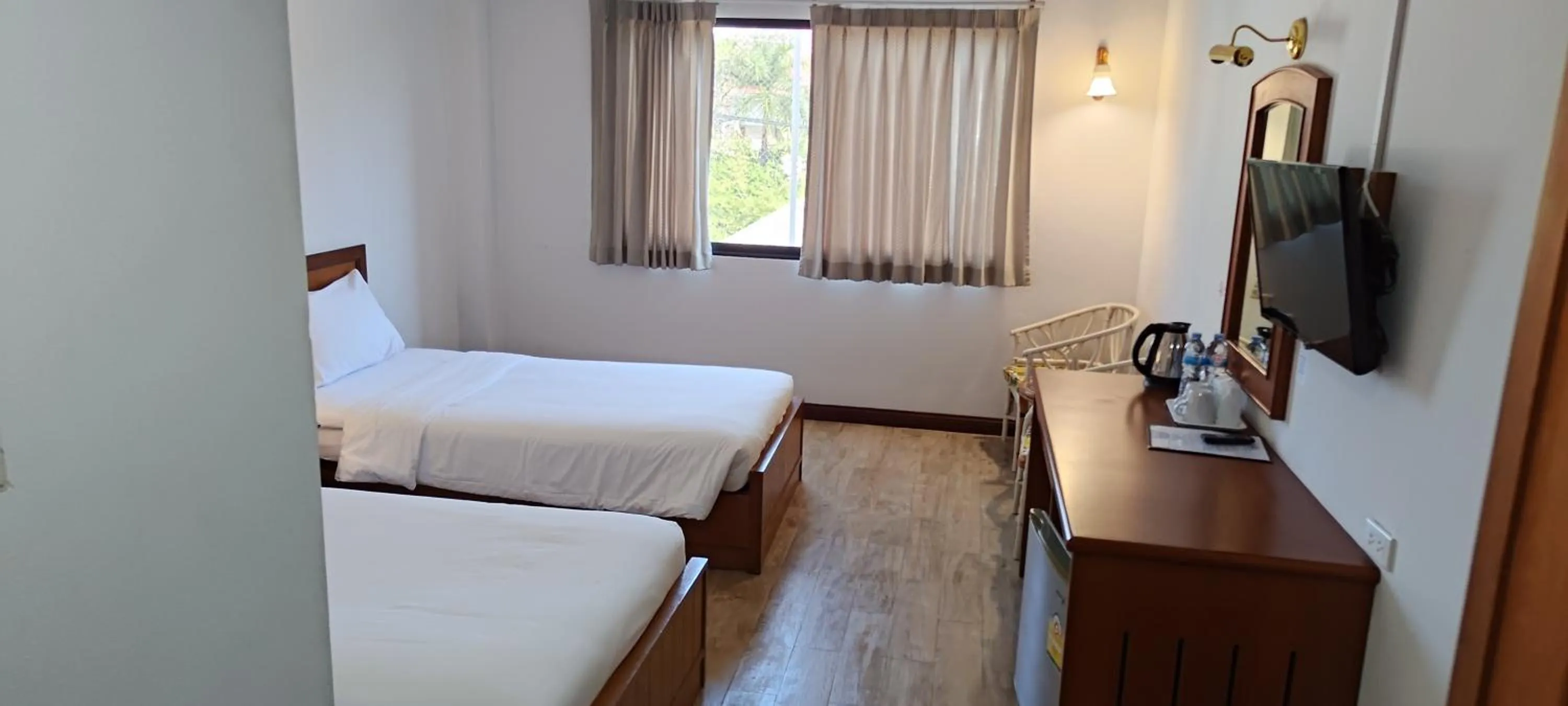 Bed in Puangpen Villa Hotel