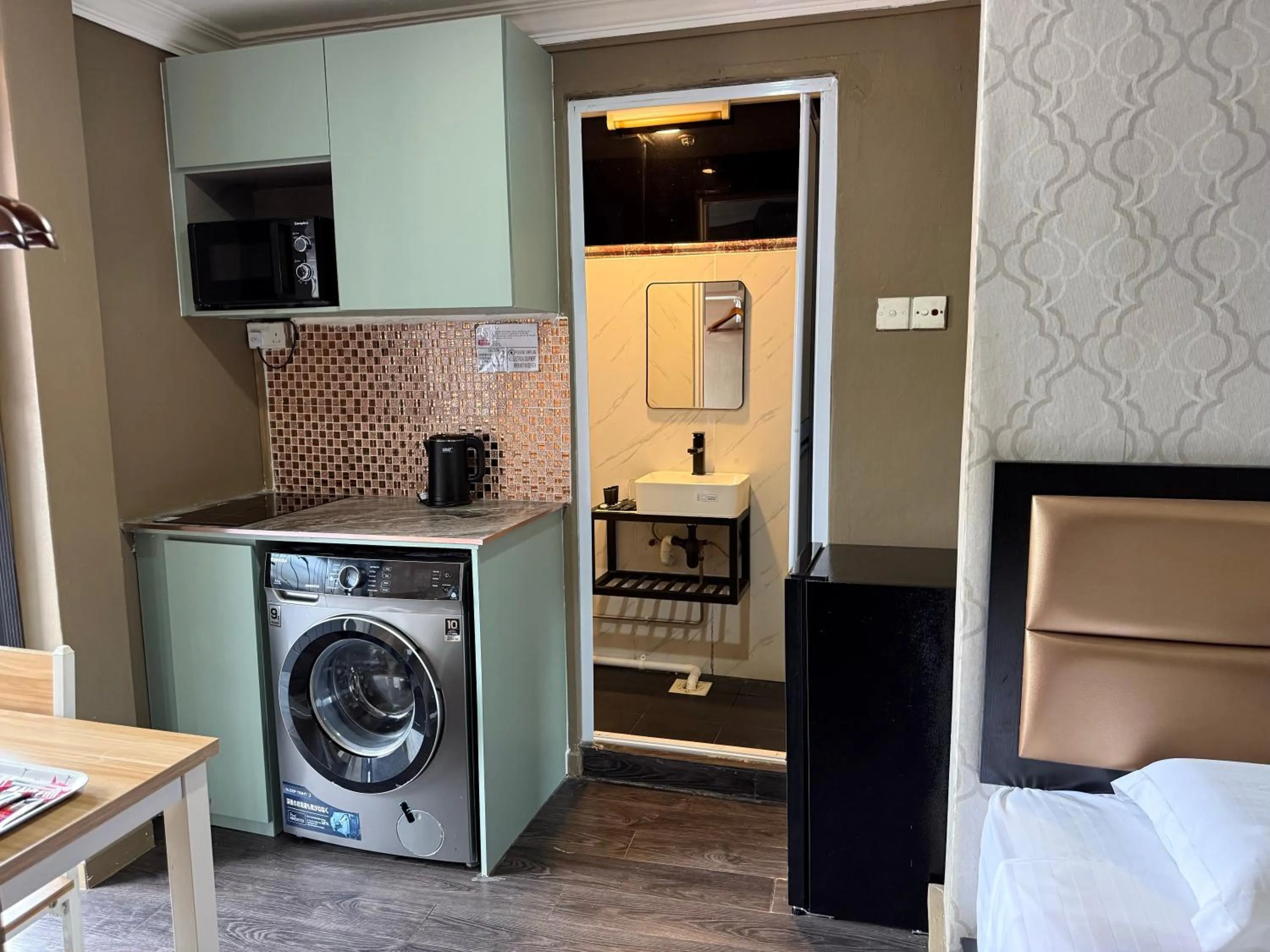 washing machine in HOTEL JJH Aliwal