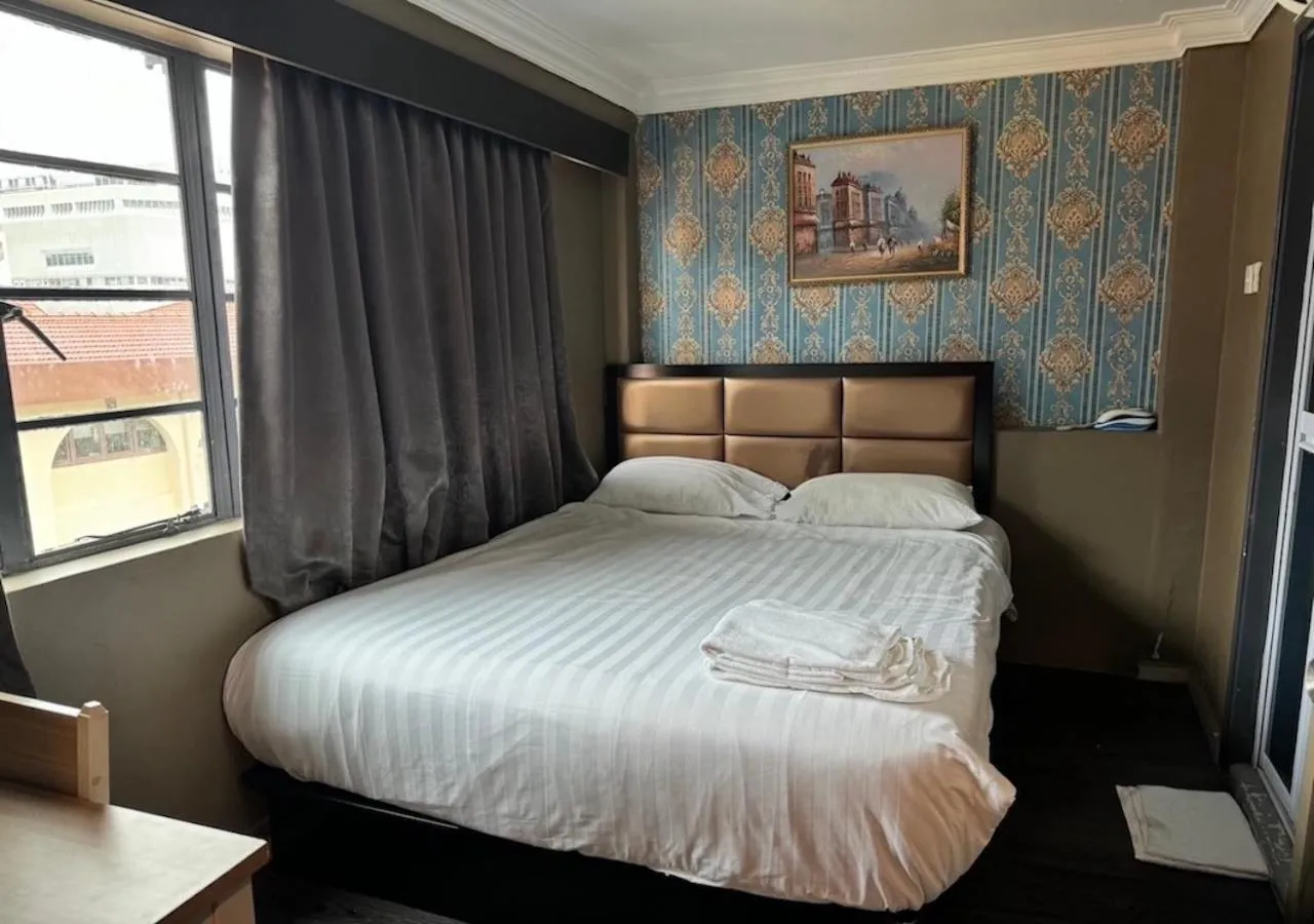 Bed in HOTEL JJH Aliwal