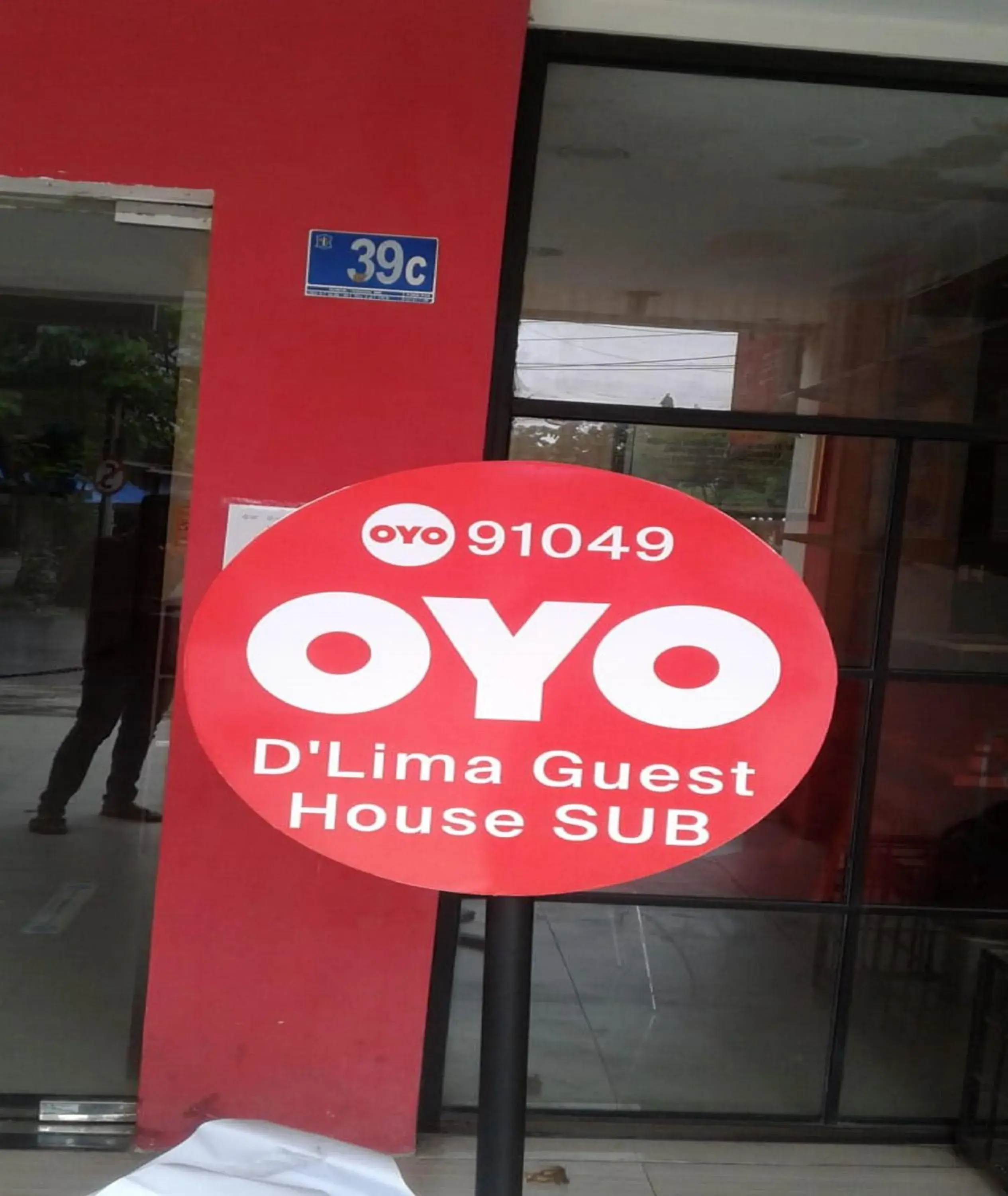 Property logo or sign in OYO 91049 D'lima Guest House Sub