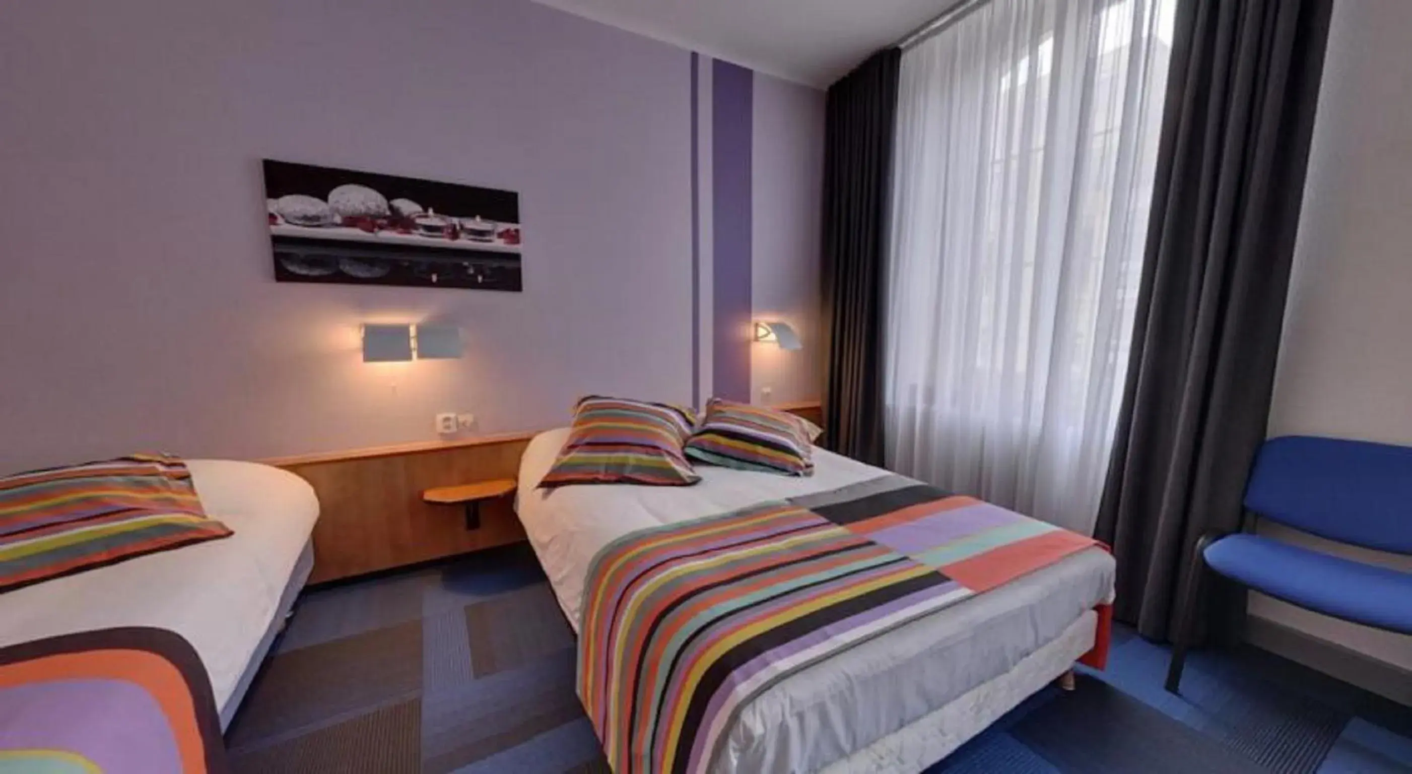 Bed in Logis Hotel de Paris
