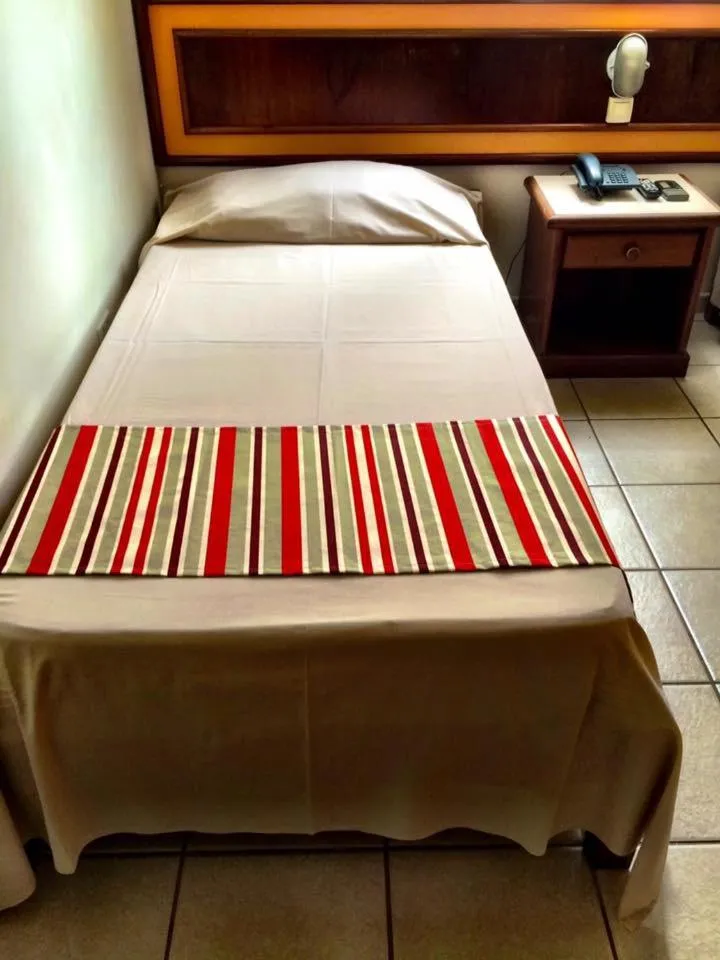 Bed in Princetel Palace Hotel