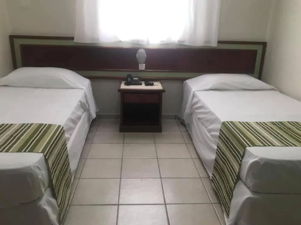 Bed in Princetel Palace Hotel