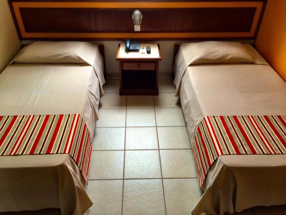 Bed in Princetel Palace Hotel