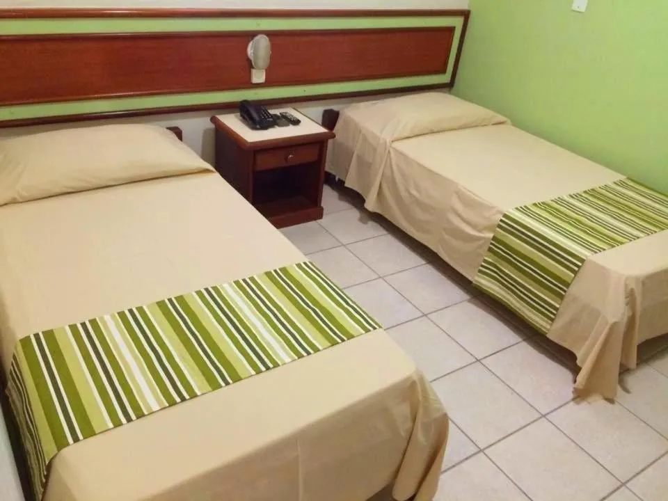 Bed in Princetel Palace Hotel
