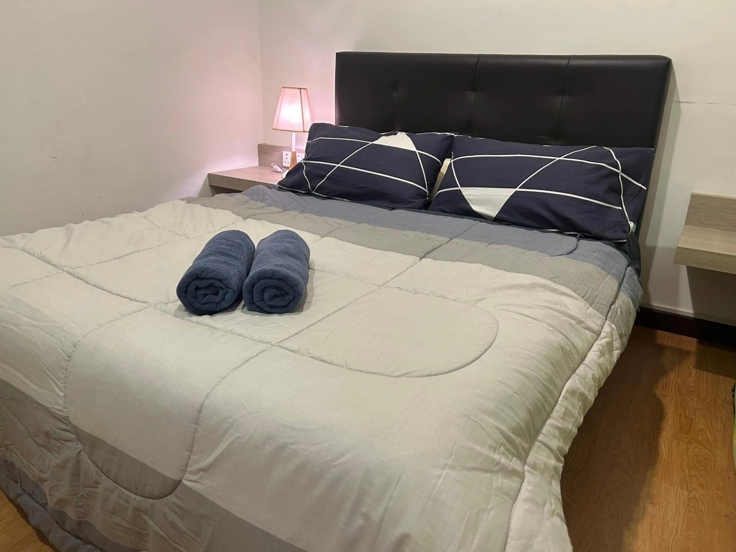 Bed in Imperial Suites Apartments