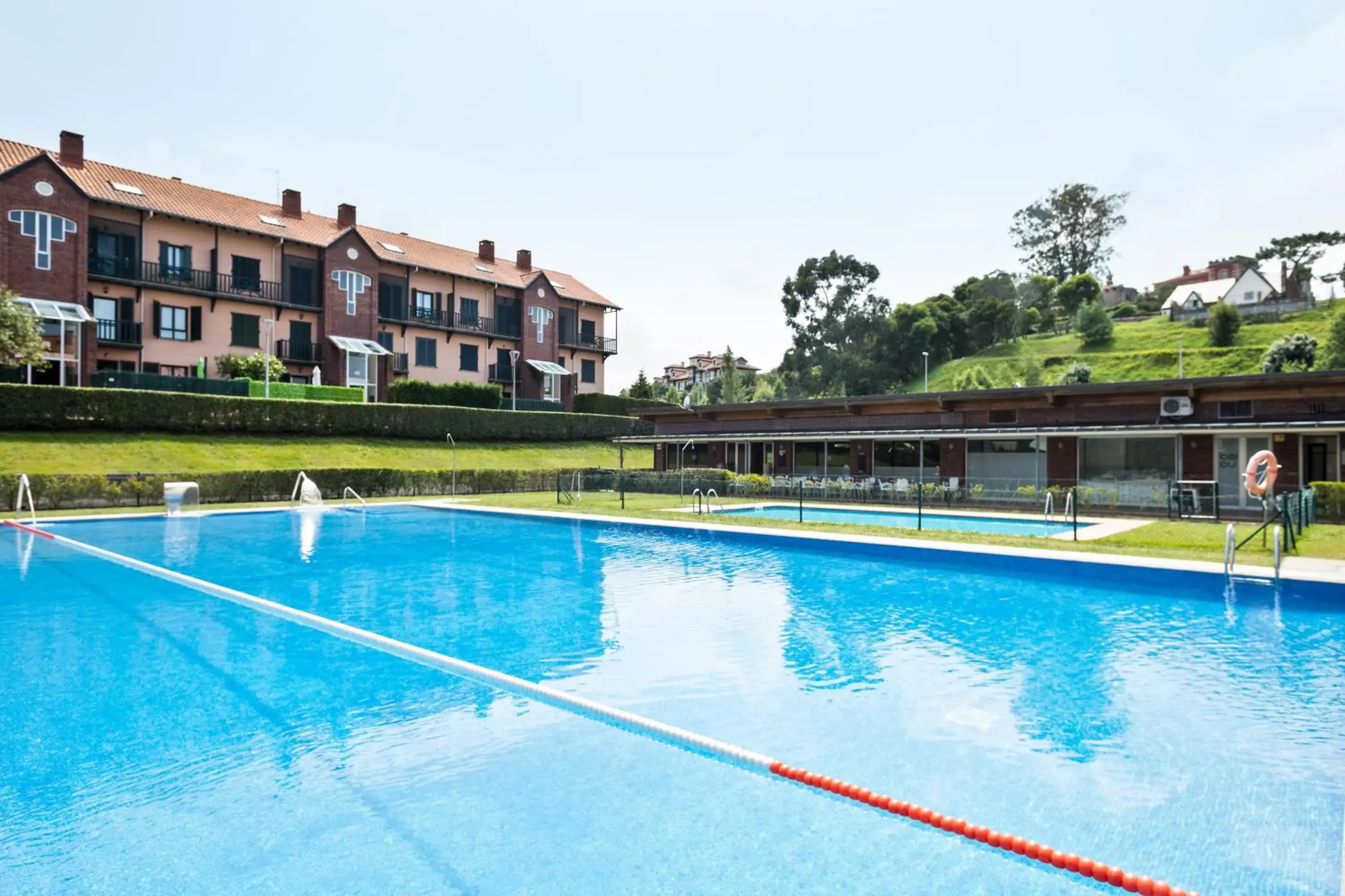 Property building in Abba Comillas Apartments Property building in Abba Comillas Apartments