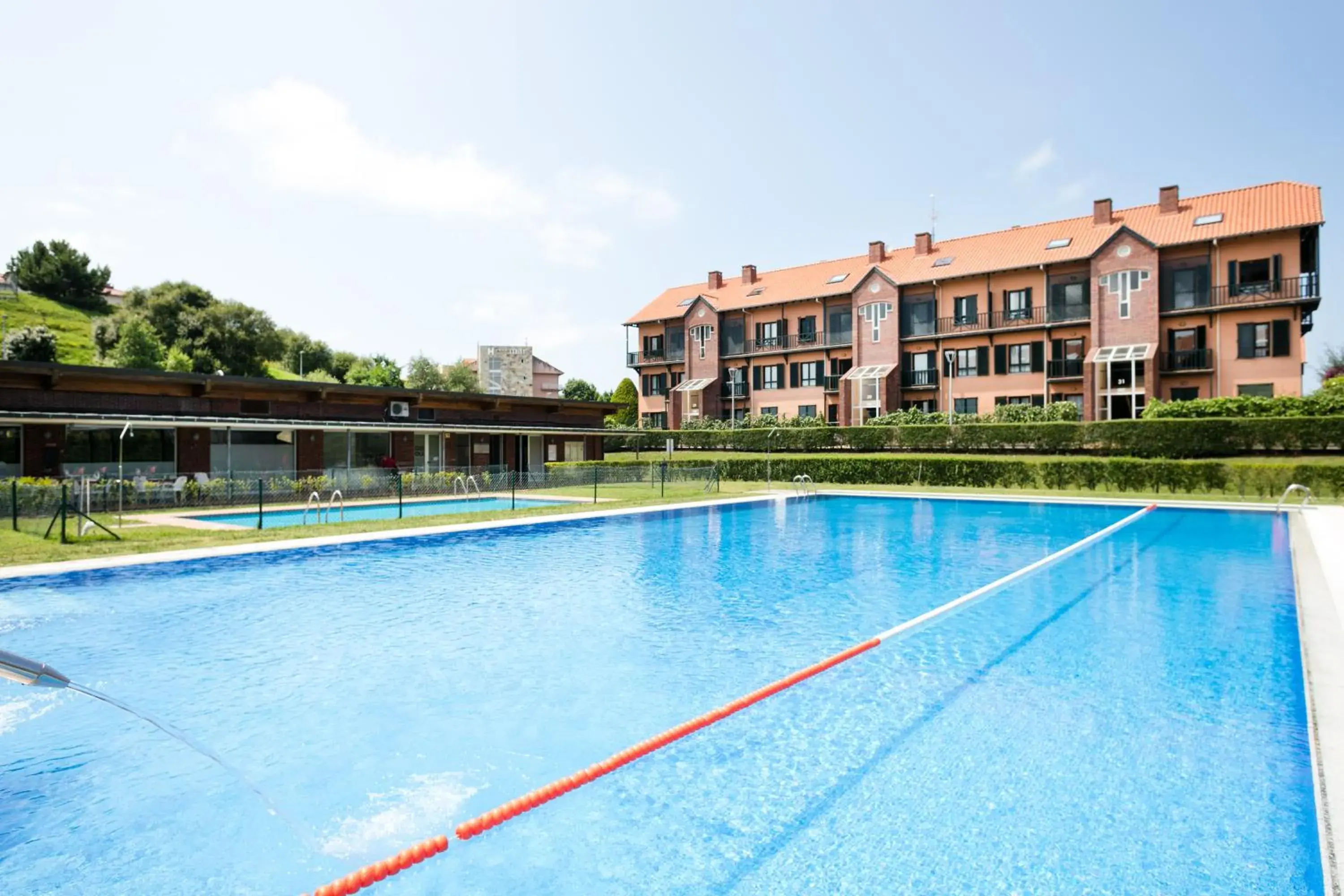 Property building in Abba Comillas Apartments Property building in Abba Comillas Apartments