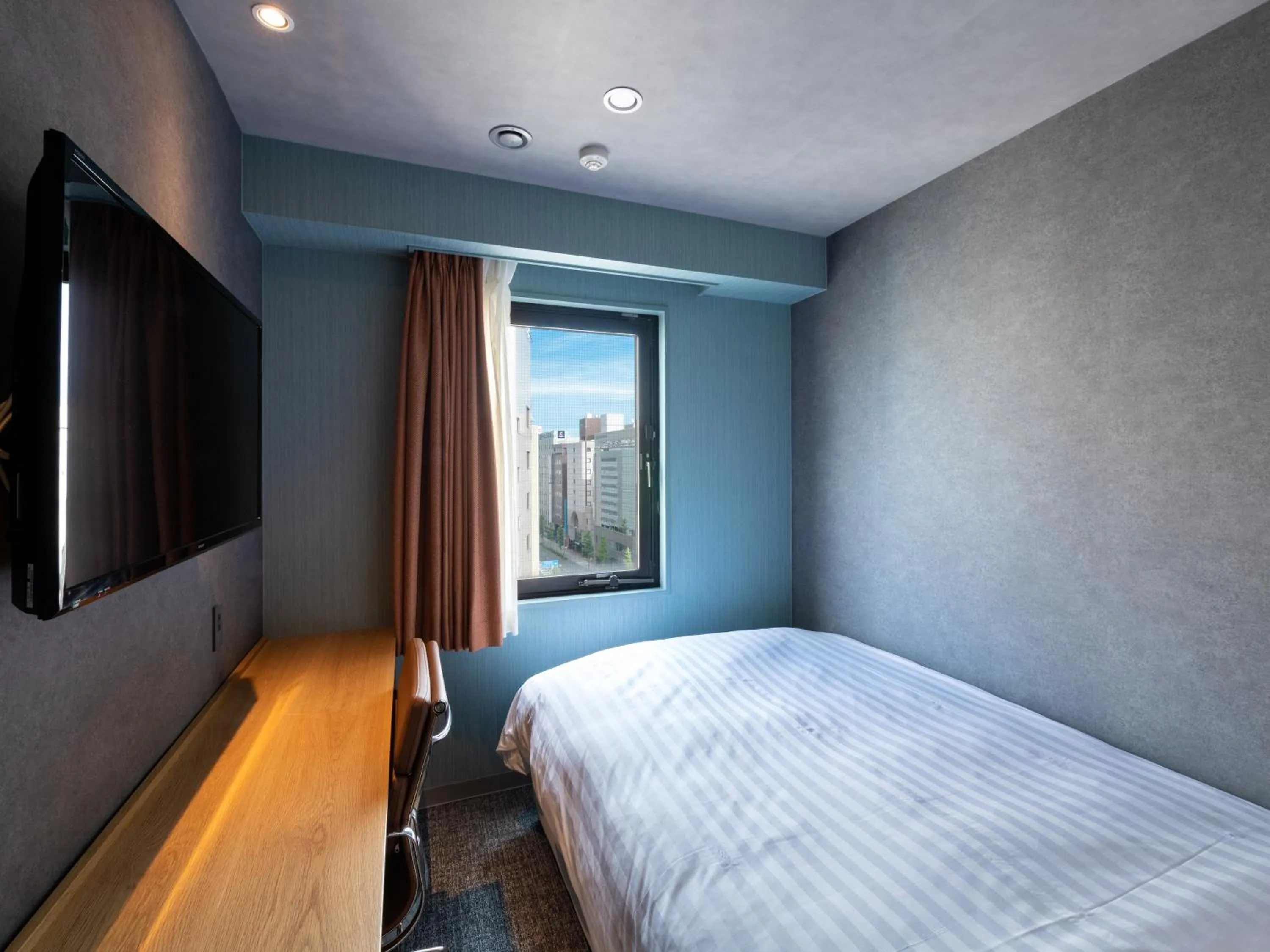 Photo of the whole room, Bed in EN HOTEL Hamamatsu