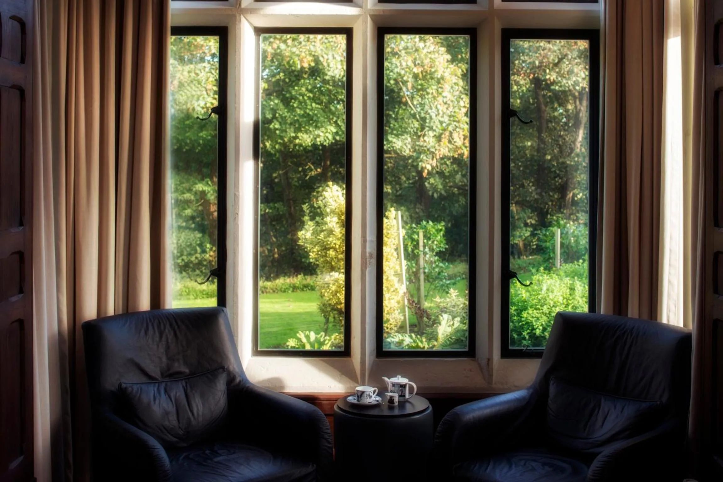 Communal lounge/ TV room in Penrhiw Priory