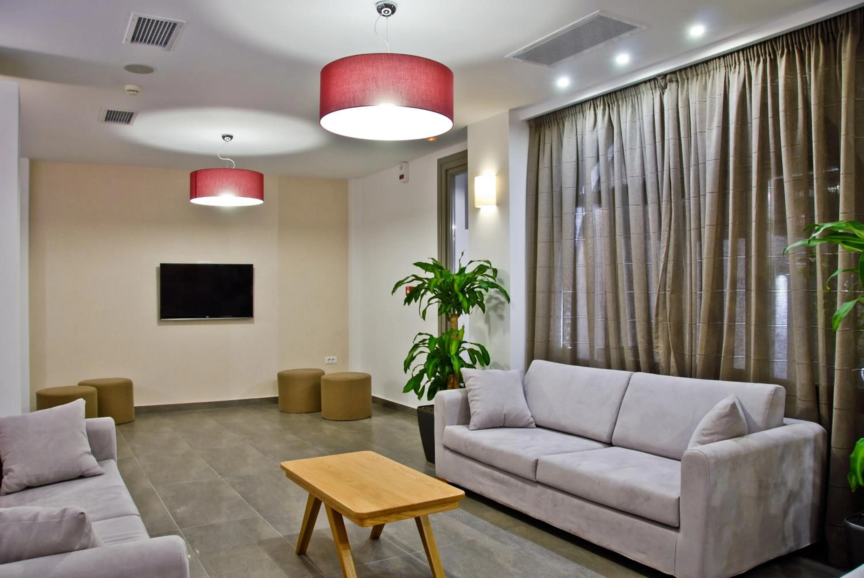 Communal lounge/ TV room in Xenia Hotel