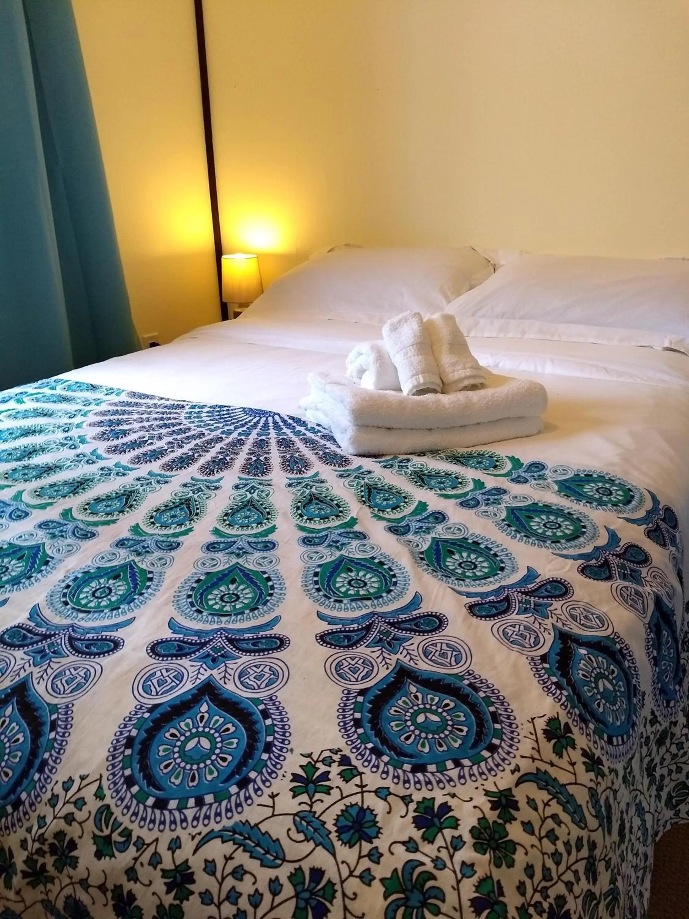 Bed in Dwight Riverside Inn