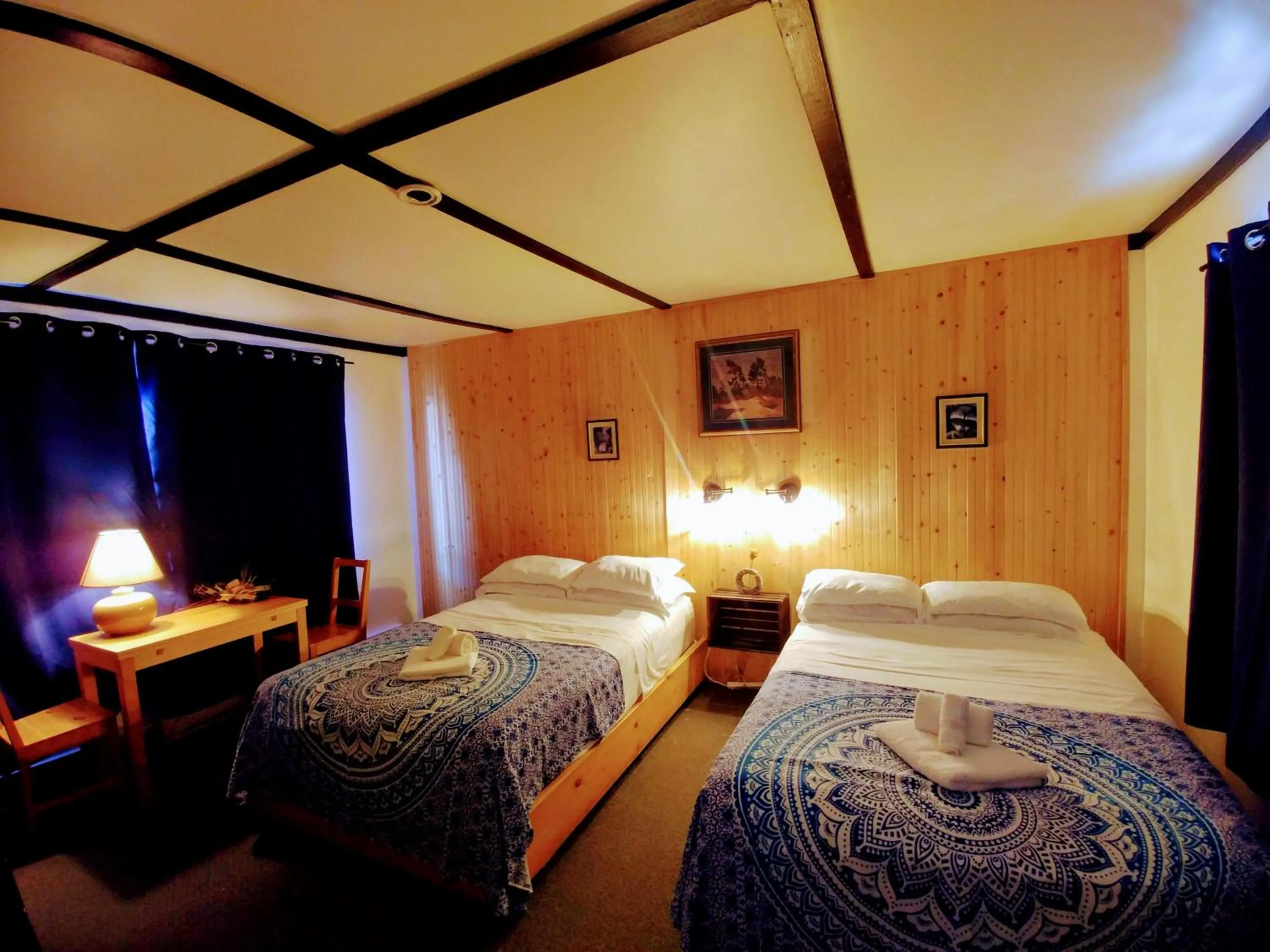 Bed in Dwight Riverside Inn