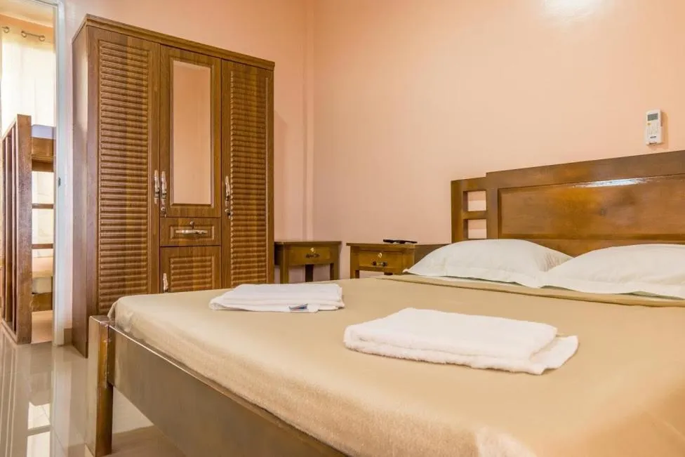 Bed in Kellocks' Seaview Apartelle