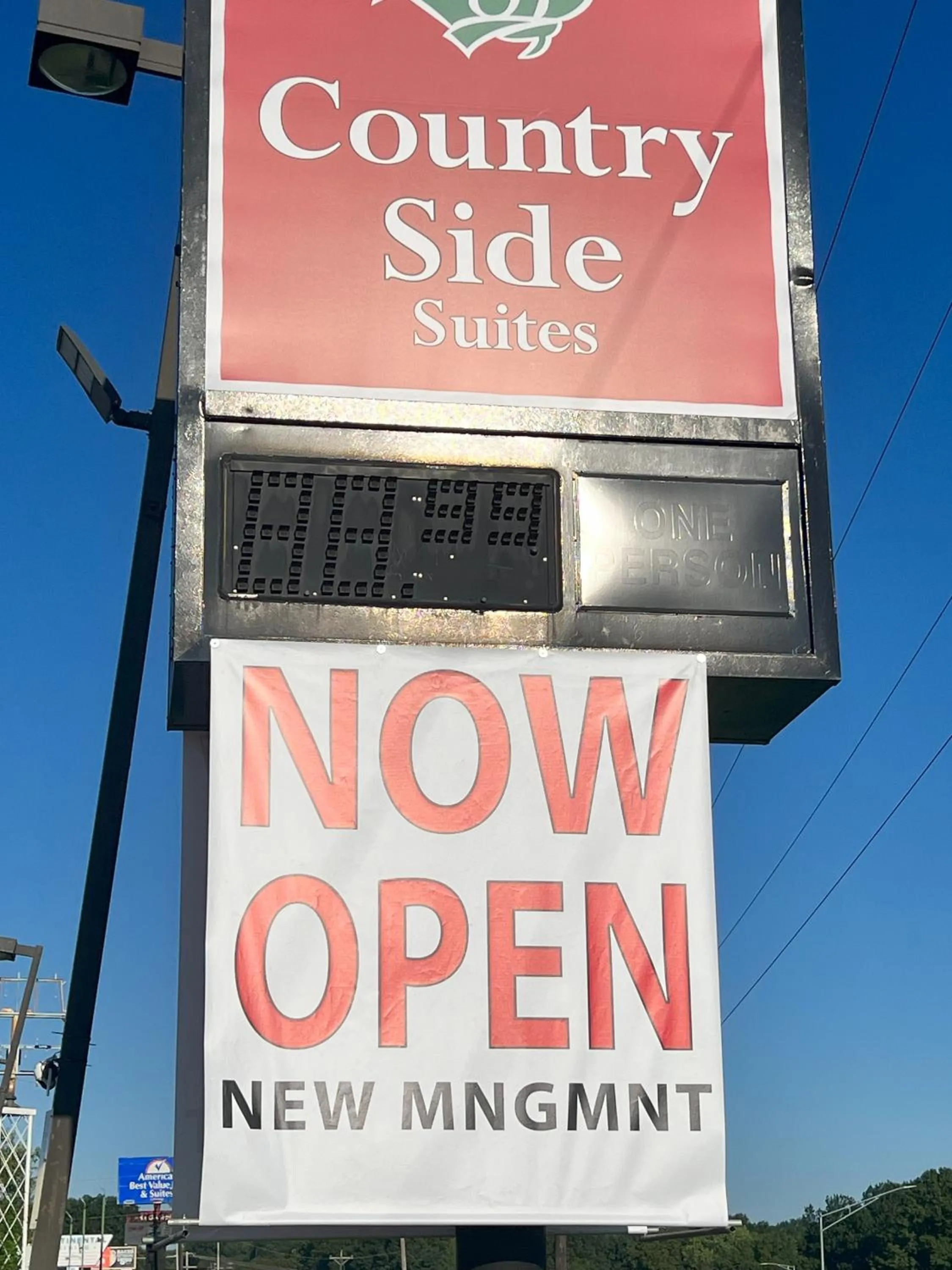 Property logo or sign in Countryside Suites Kansas City Independence I-70 East Sports Complex Hotel