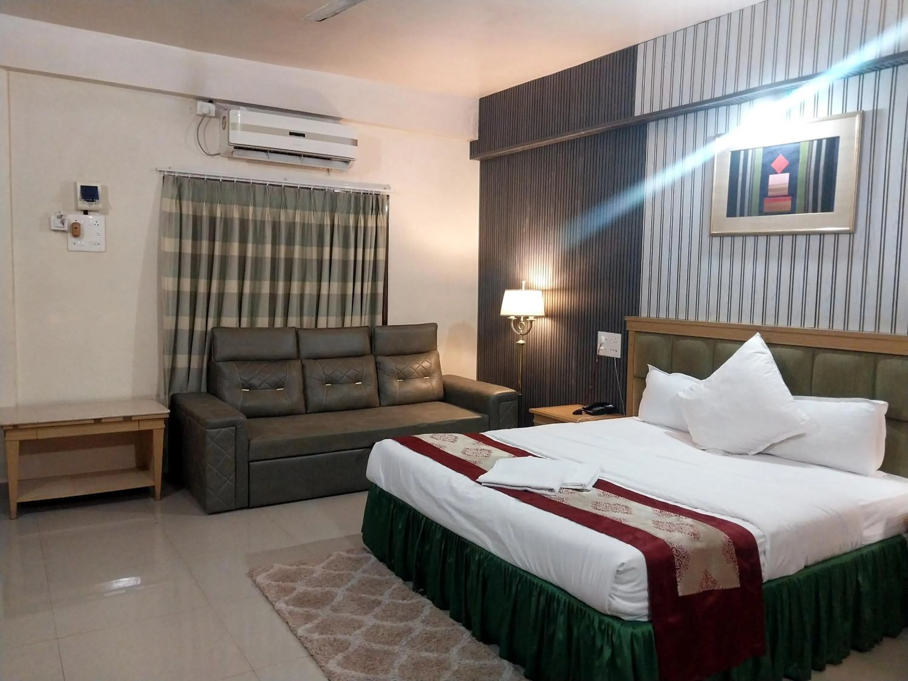 Bed in Mango Valley Resort Ganpatipule