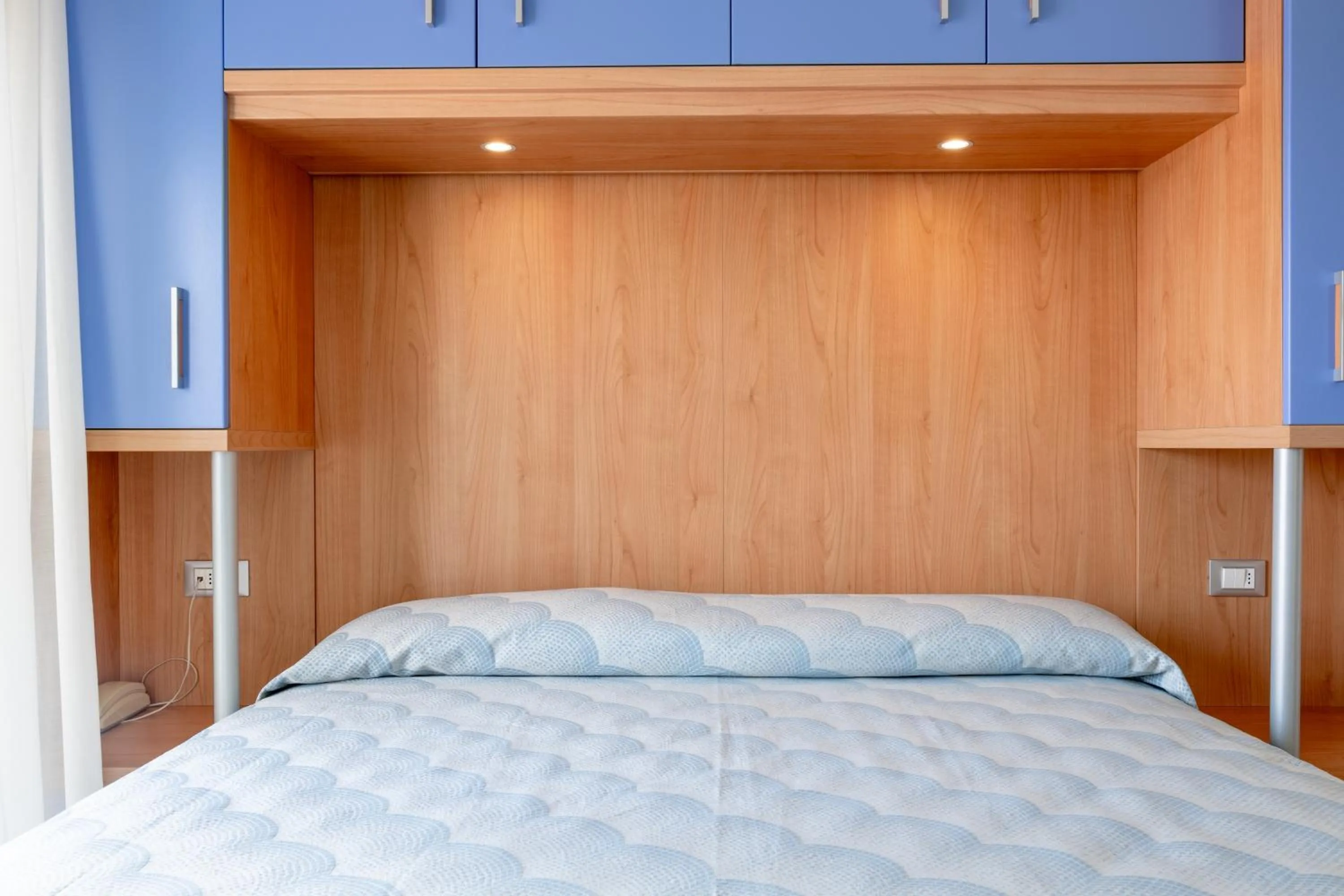 Bed in Hotel Riviera