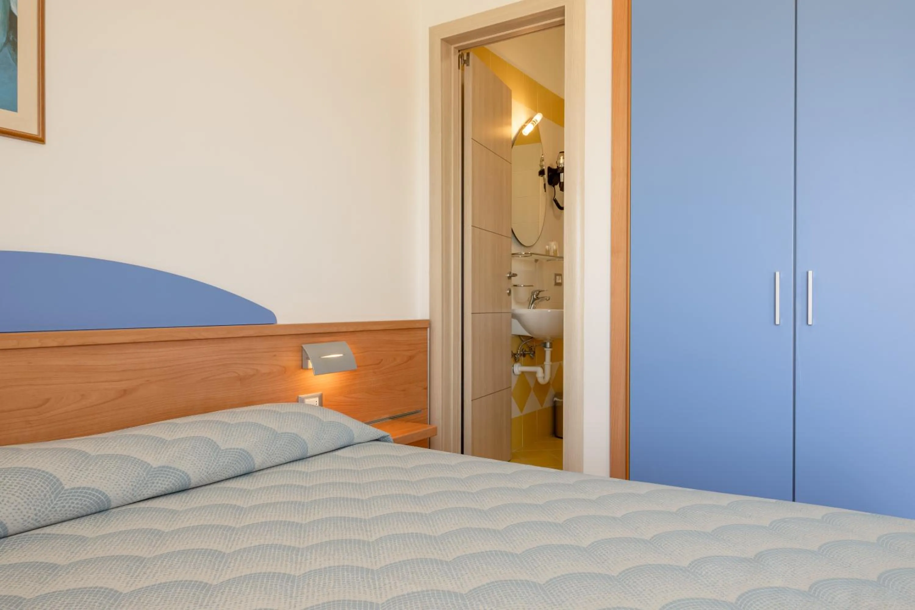 Bed in Hotel Riviera