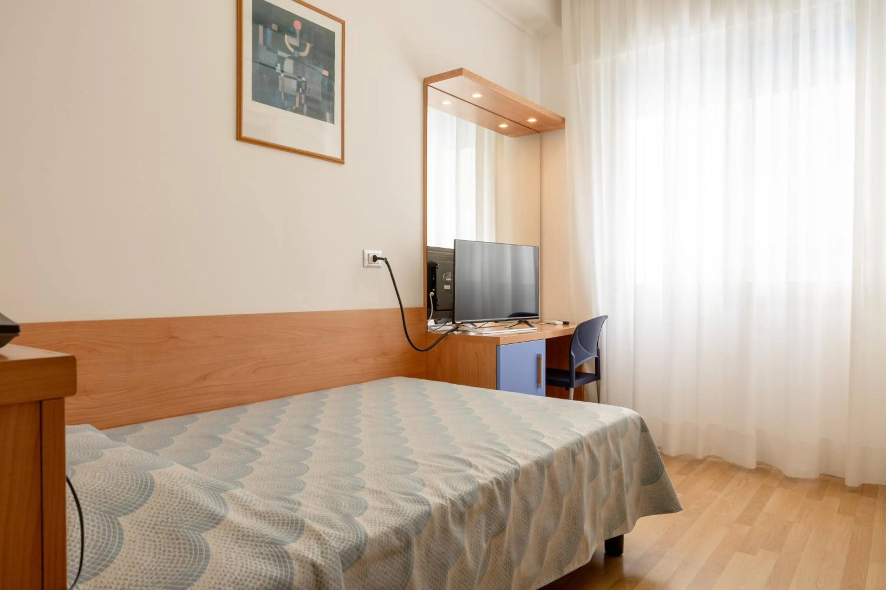 Bed in Hotel Riviera