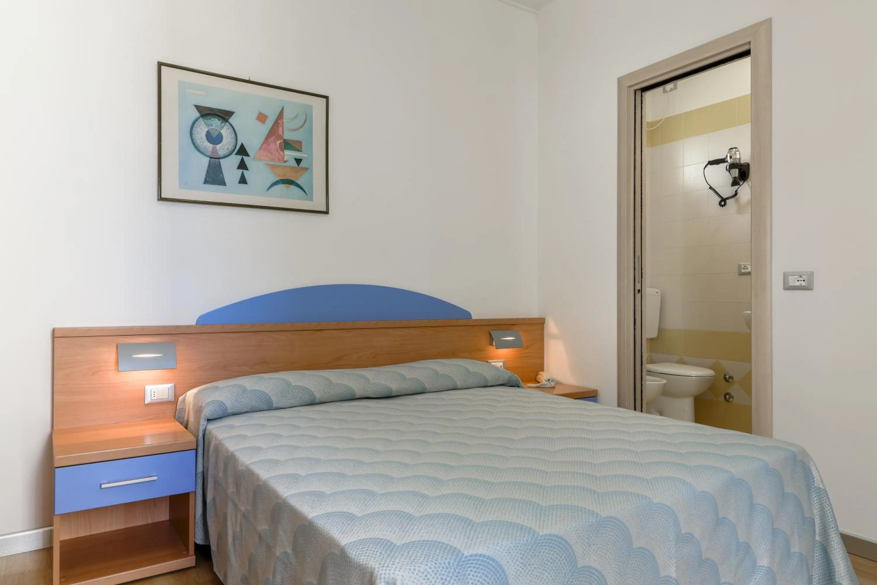 Bed in Hotel Riviera