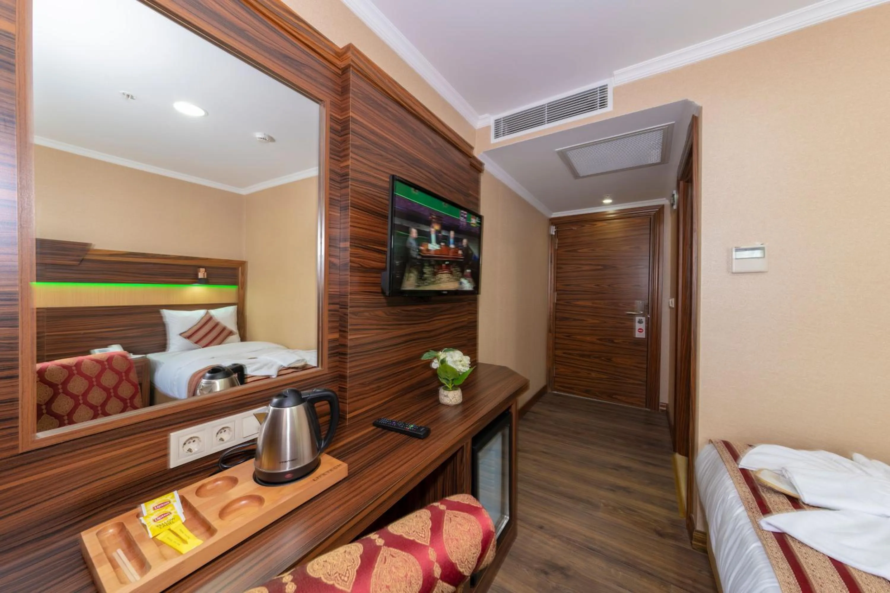 Bed in Vision Deluxe Hotel