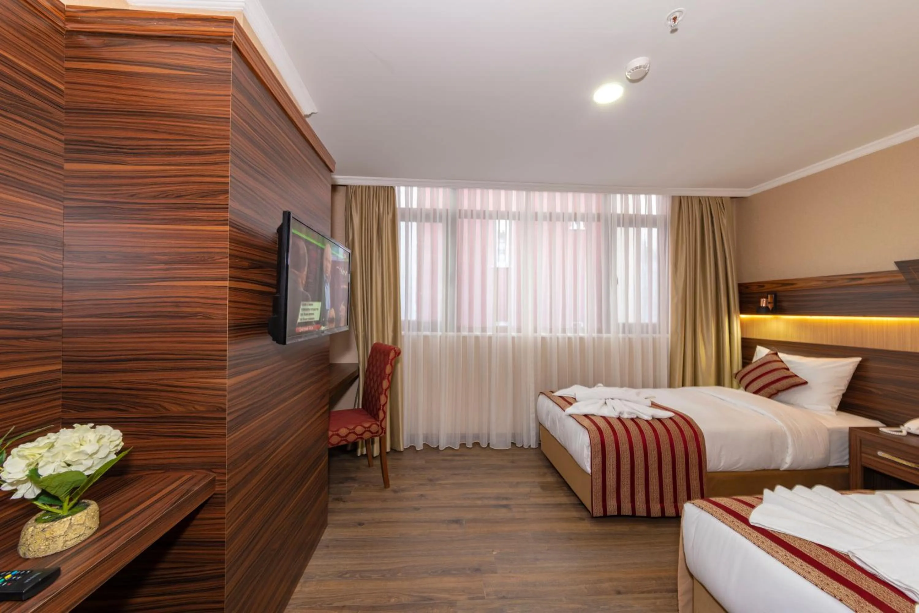 Bed in Vision Deluxe Hotel