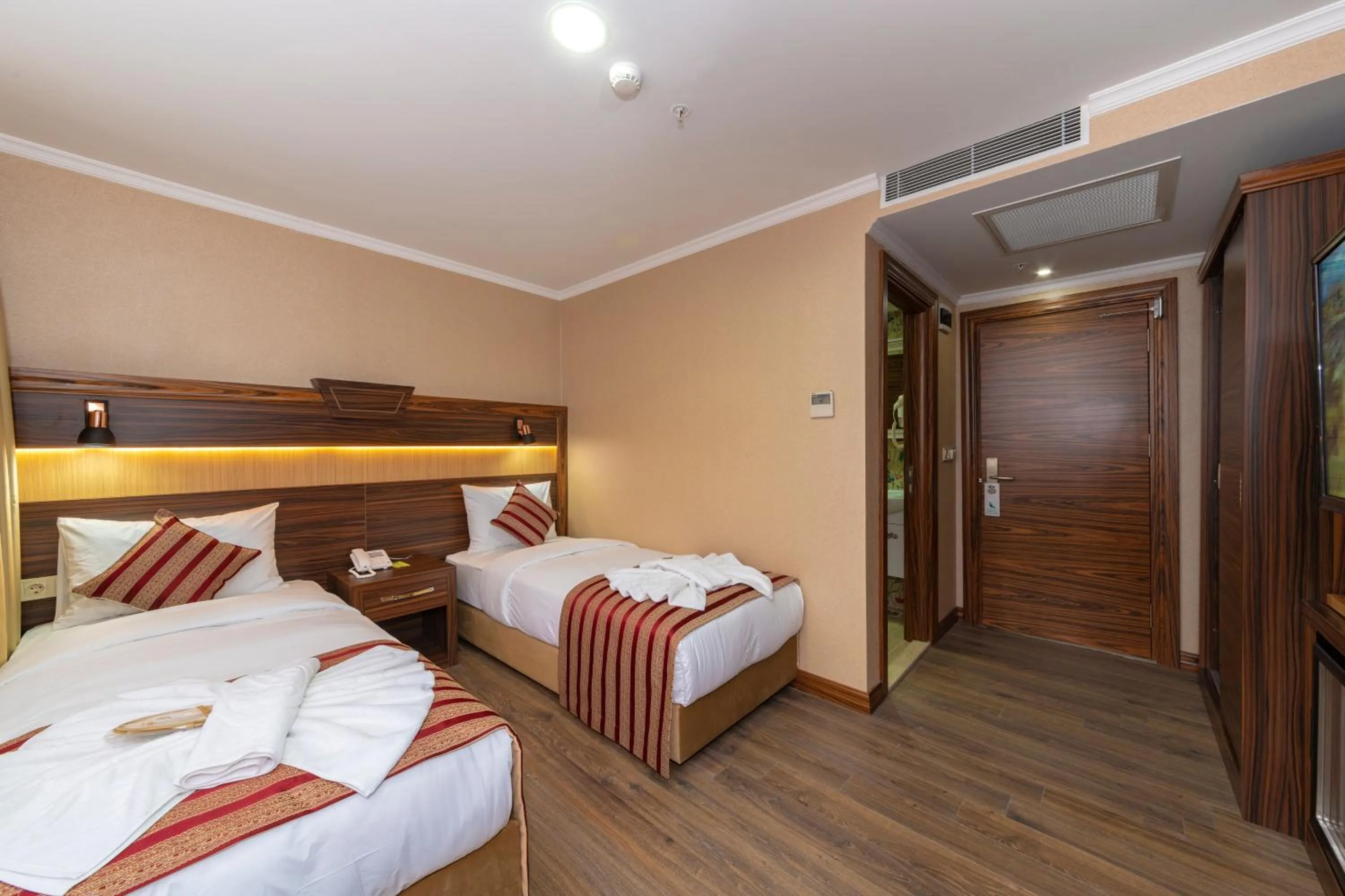 Bed in Vision Deluxe Hotel