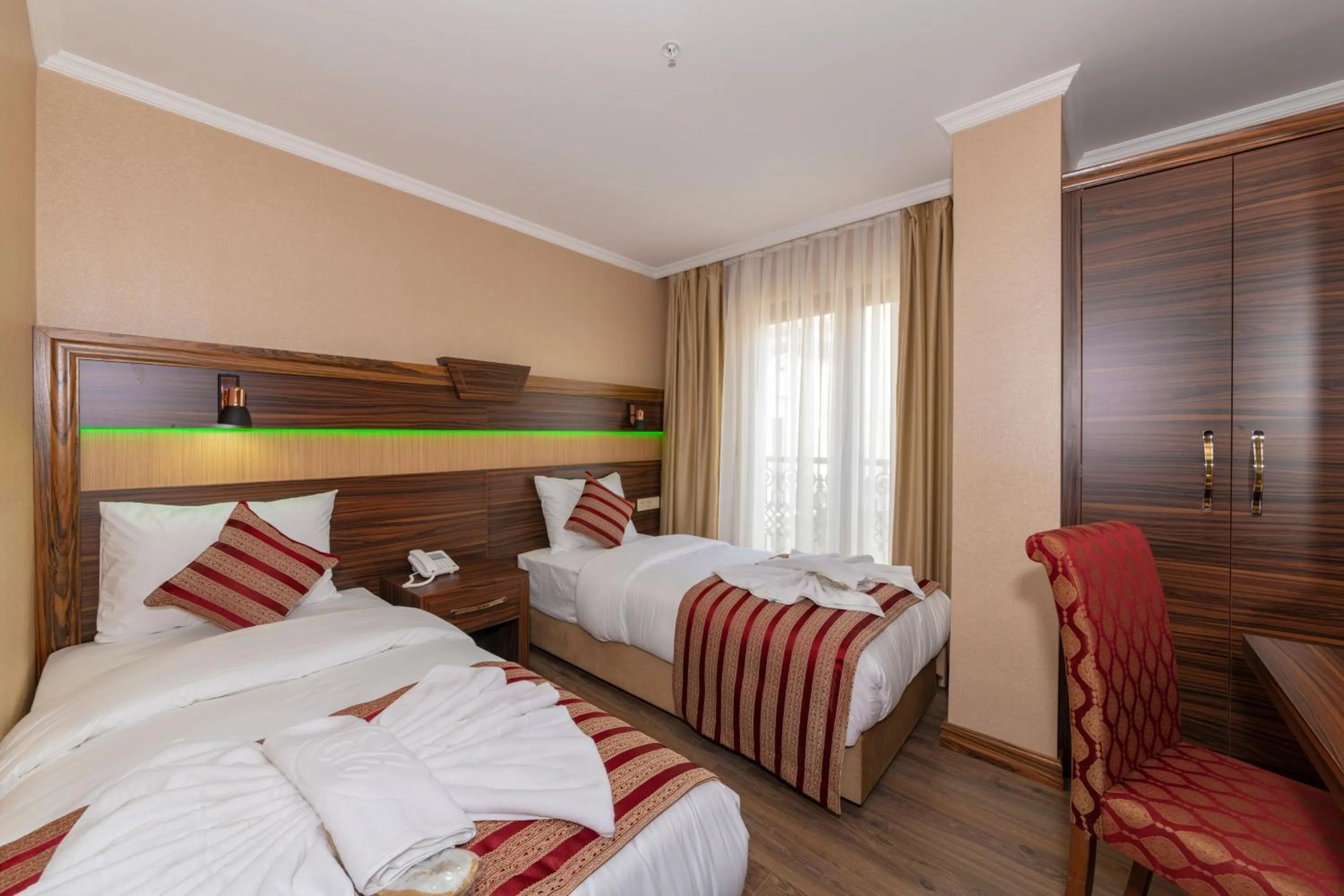 Bed in Vision Deluxe Hotel